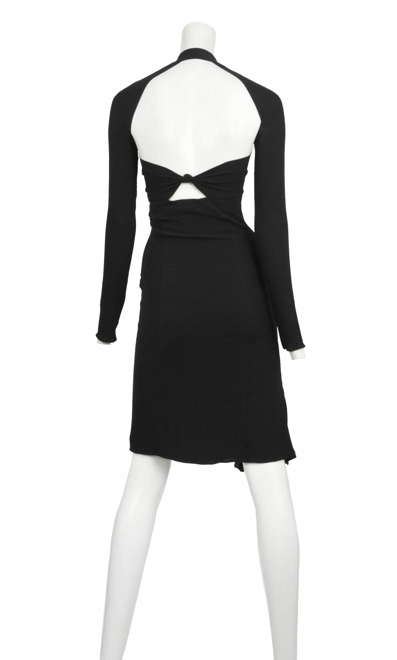 Tom Ford for Gucci black silk stretch dress with halter style neckline and cutout bodice with front slit. Open back has bow detail.