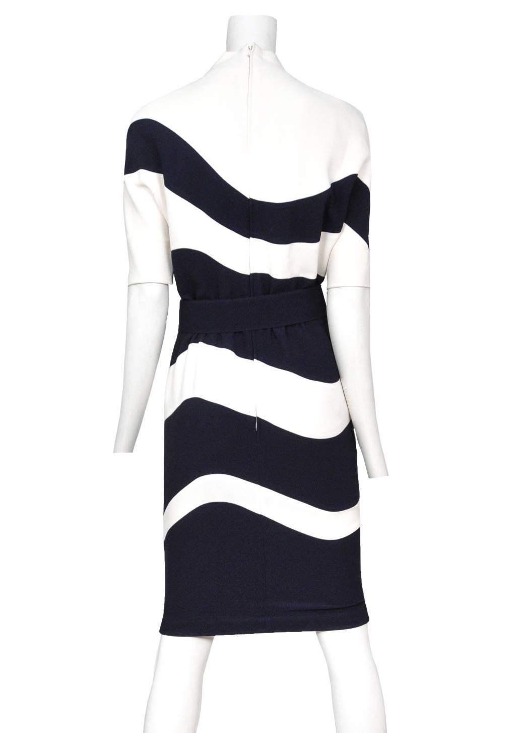 Vintage Thierry Mugler navy and ivory abstract stripe knee length dress featuring an abstract shape at the collar, 3/4 length sleeves and matching navy waist belt.
