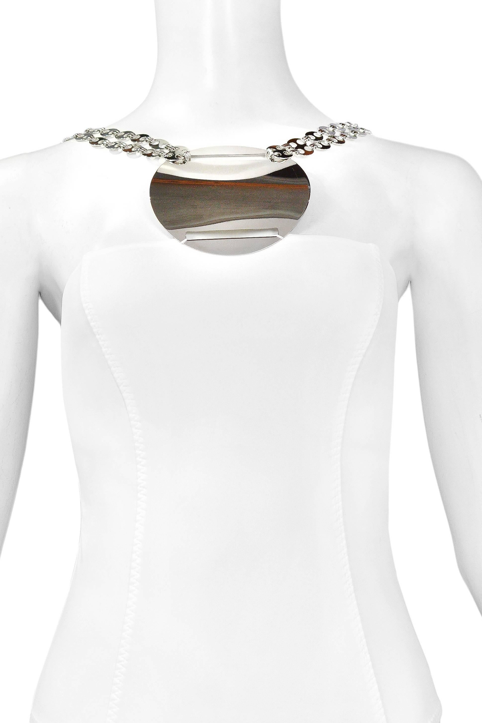 Paco Rabanne white one-piece swimsuit with large chrome disc at breast plate. Double straps feature classic silver tone chain link pieces. The bust line has a double layer white lining for coverage. Never worn new vintage. 