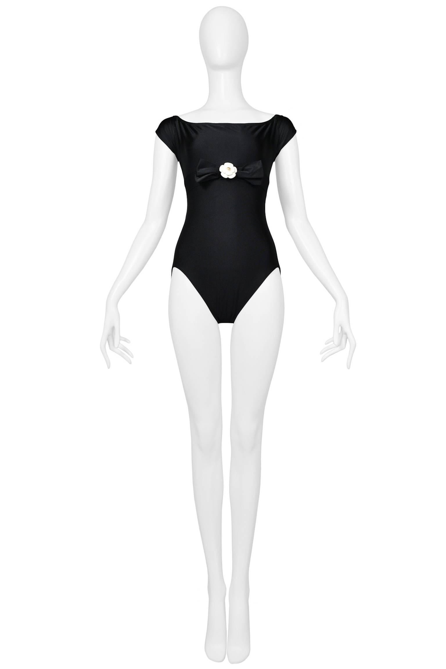 Vintage Chanel black bodysuit or swimsuit with black satin bow and cast or molded sculptural plastic off white 