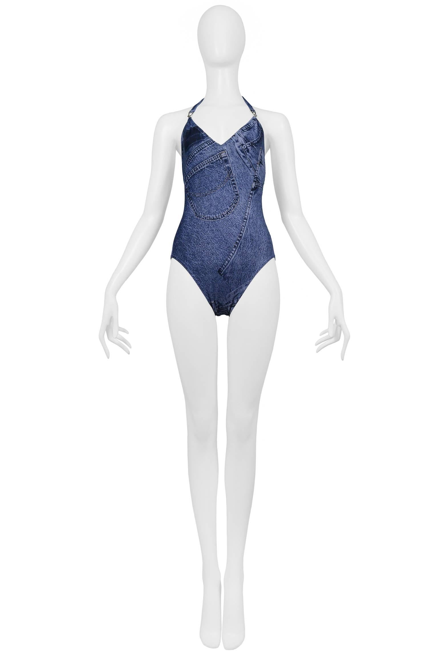 Vintage John Galliano for Christian Dior trompe l'oeil denim one-piece swimsuit. Bathing suit features silver tone hardware. Halter front, low scoop back, and full coverage bottom. Featured in numerous advertisements. Never worn. Collection circa