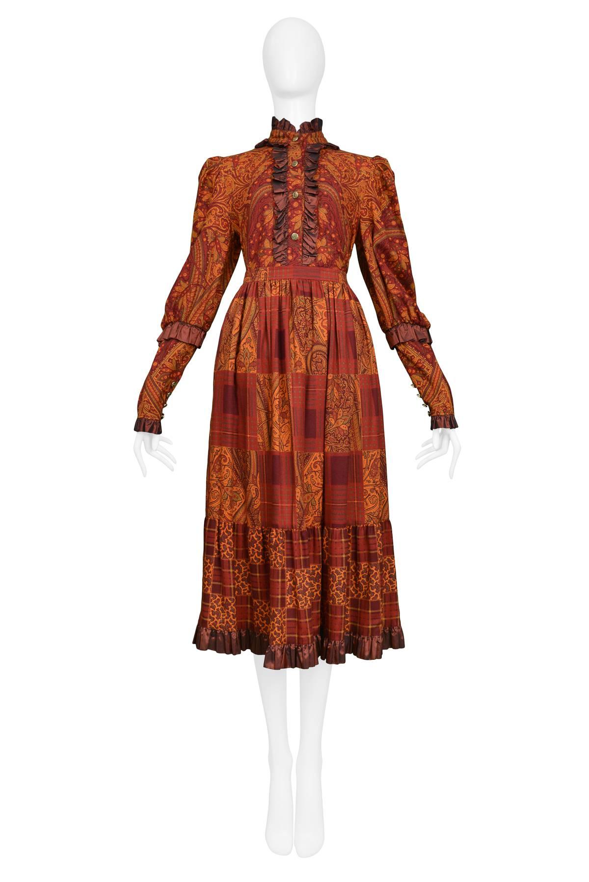 Resurrection Vintage is excited to offer a vintage autumn paisley wool skirt and blouse ensemble featuring a blouse with taffeta trim at the collar, cuffs, and hem, gold buttons on the cuffs, and a matching skirt with waistband, side zipper, and