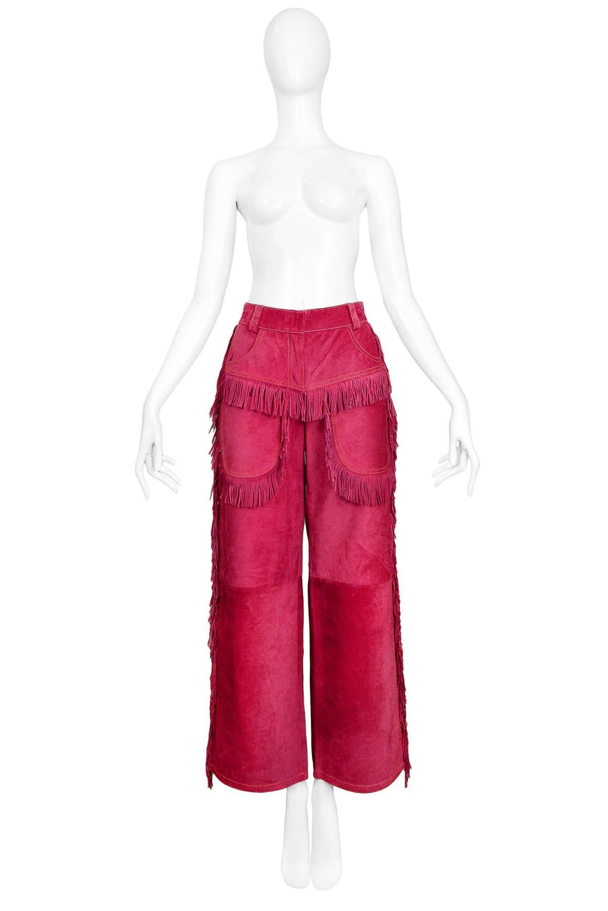 Vintage Gianni Versace iconic magenta suede Western inspired pants with patch pockets and fringe detail. Autumn/Winter 1992 Collection. 

New with Original Tags. Never worn.

Size: IT 40
