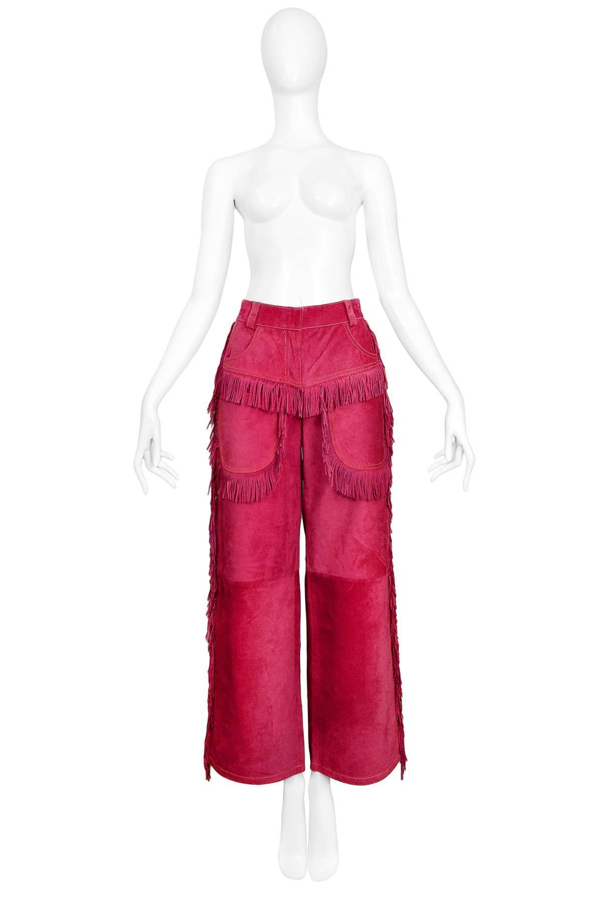 Vintage Gianni Versace iconic magenta suede Western inspired pants with patch pockets and fringe detail. Autumn/Winter 1992 Collection. 

New with Original Tags. Never worn.

Size: IT 40