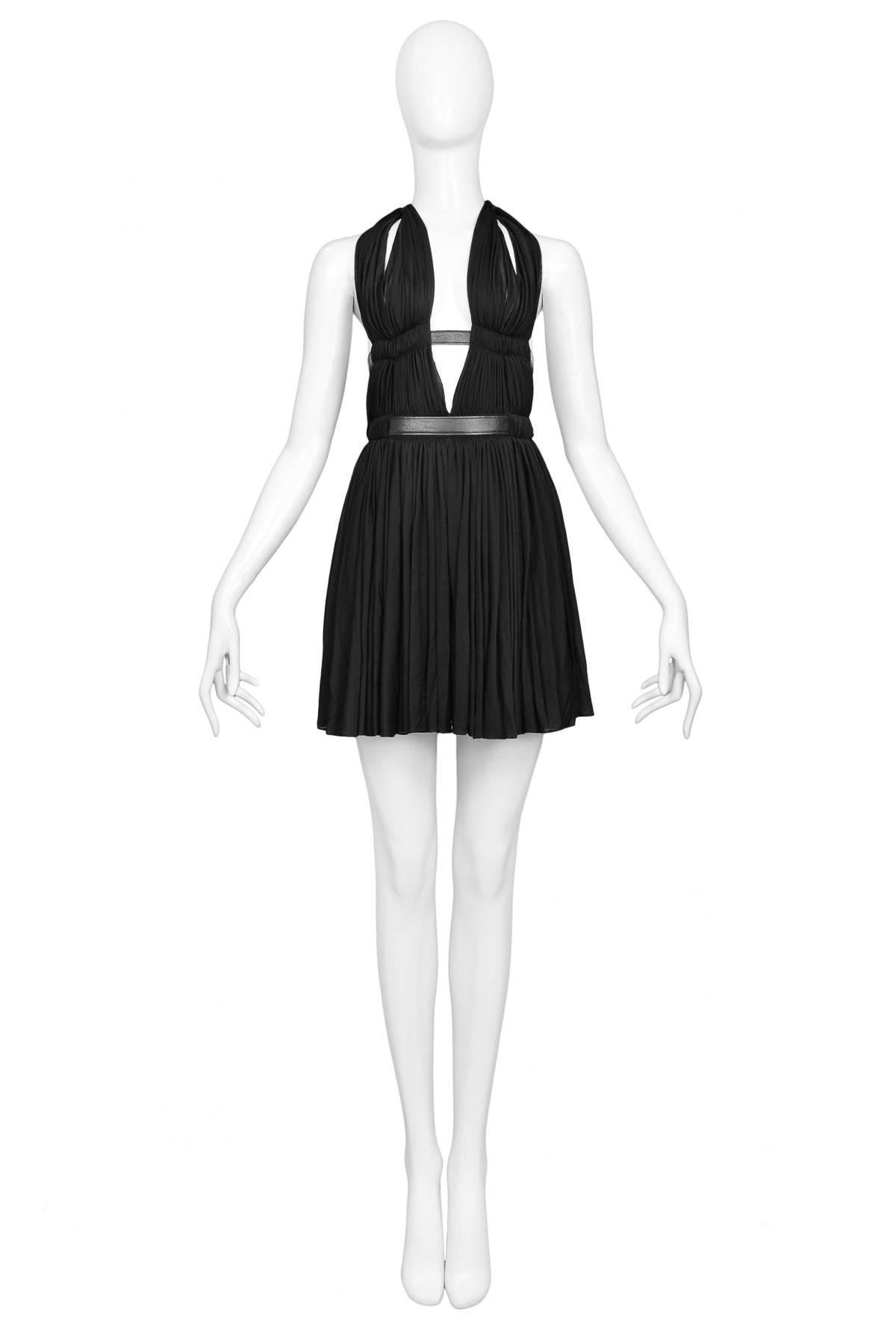 Vintage Azzedine Alaia ultra-rare museum quality Goddess Mini Dress with halter plunge neckline, double belted waist & cut-out details. Spring/Summer 1991 Collection.

Excellent Condition; Prestine.

Size: 38