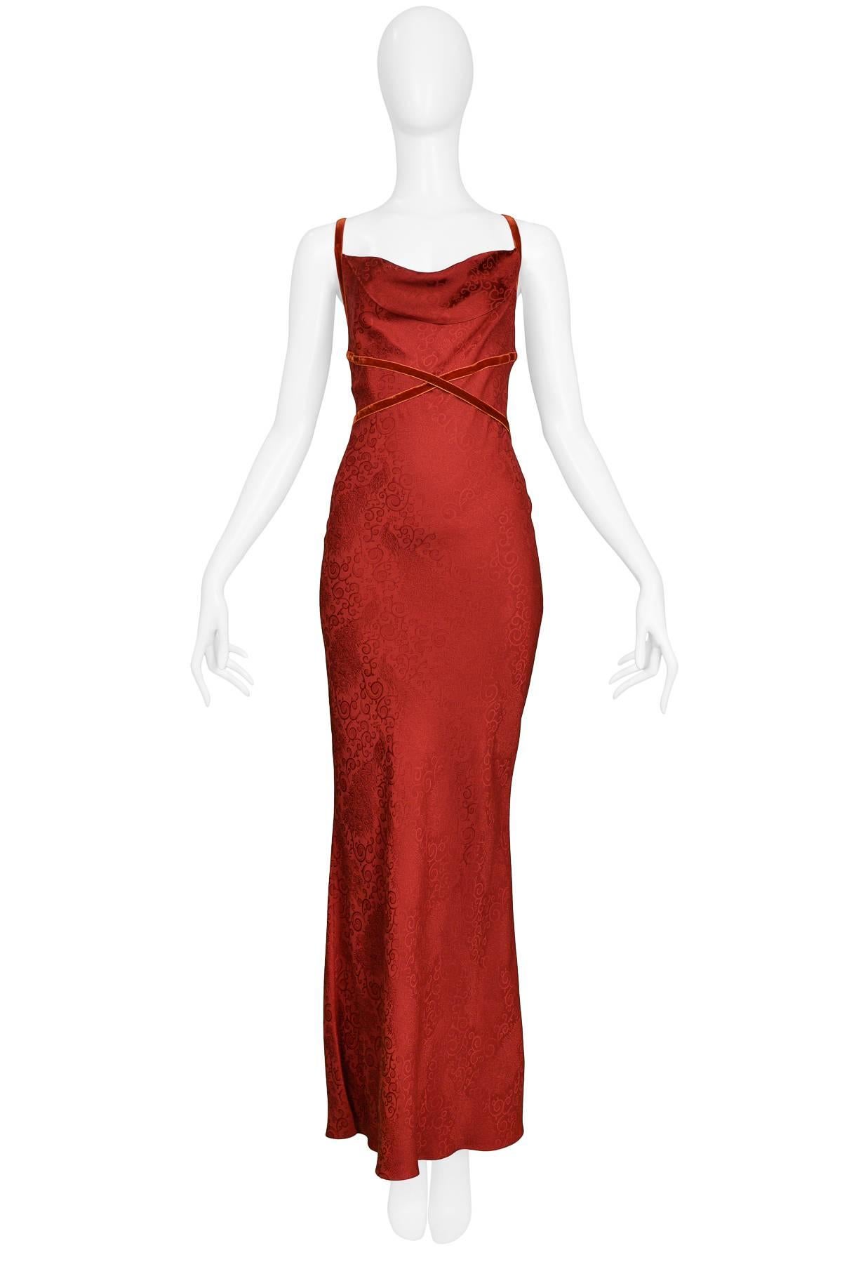 Vintage 1990s John Galliano red jacquard bias cut slip gown with velvet ribbon detail. Gown features criss-cross straps & tie at back. 

Excellent Condition. 

Size: 38 
