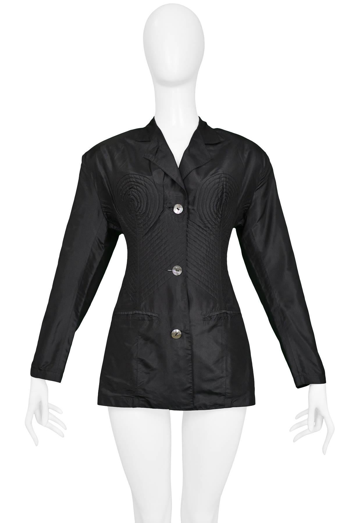 Resurrection Vintage is excited to offer a vintage Jean Paul Gaultier black fitted jacket featuring shell buttons down center front, circular cone detailing at the bust, diagonal stitching along the rib cage, and front pockets.

Jean Paul
