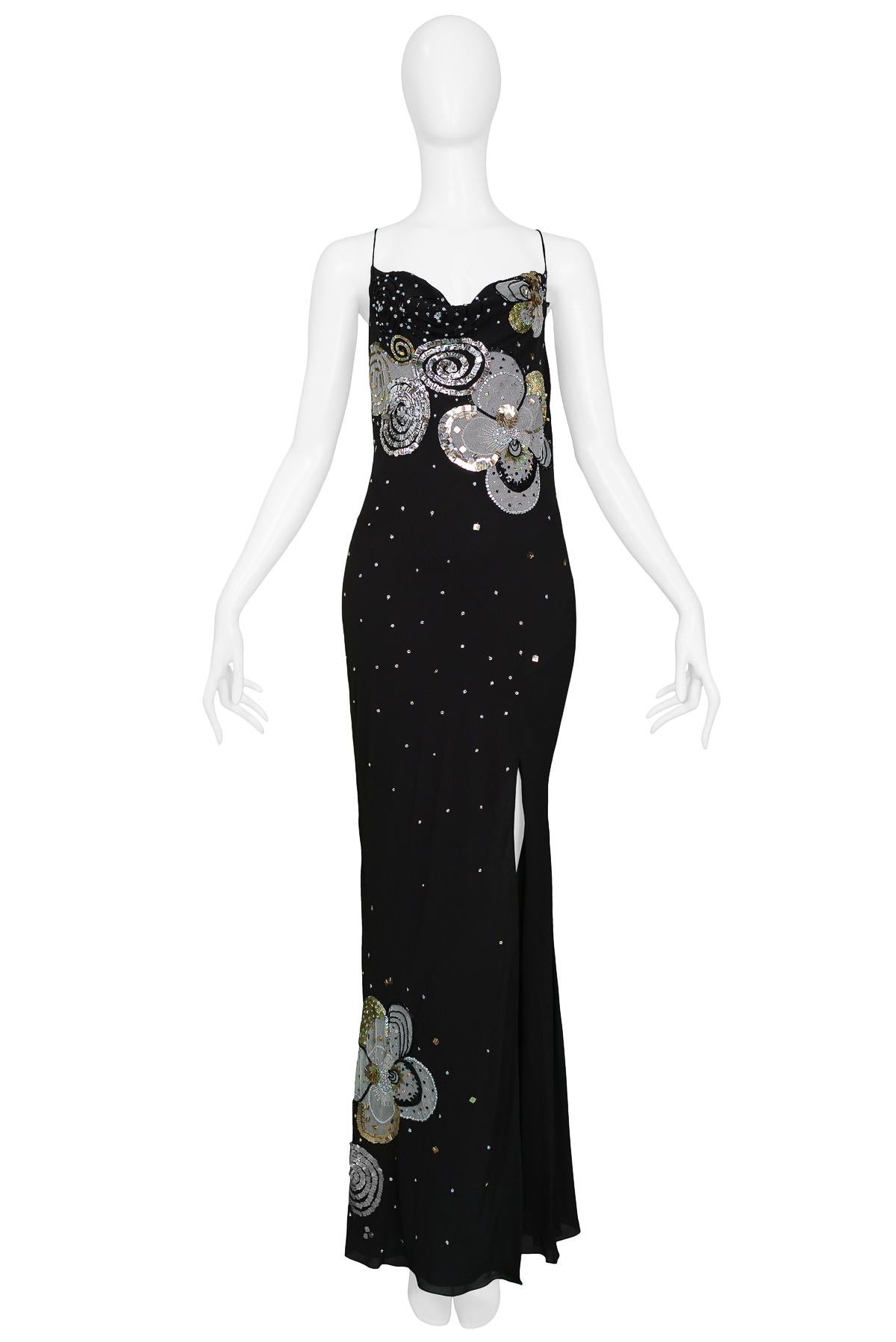Vintage John Galliano for Christian Dior black silk chiffon bias-cut evening gown. The gown features a cowl neckline and low, draped back, and it’s classic sleek silhouette is embellished with floral mesh appliqué, iridescent sequins, crystals,