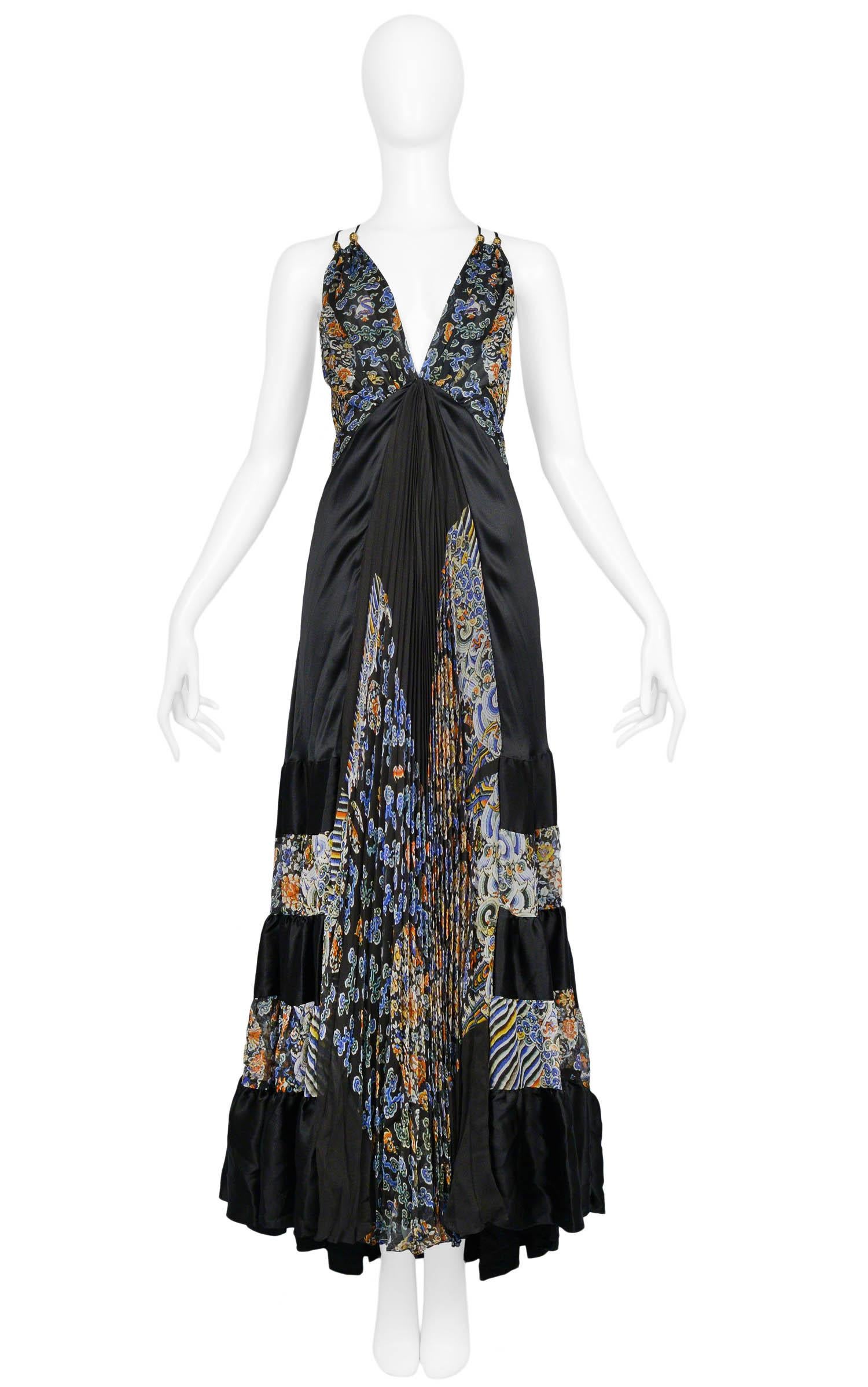 Vintage Nicolas Ghesquière for Balenciaga black silk maxi gown with halter plunge neckline featuring Chinese printed paneling throughout, gold tone hardware at straps, accordion pleating down the center front & multi tiered flounce at the hem. From