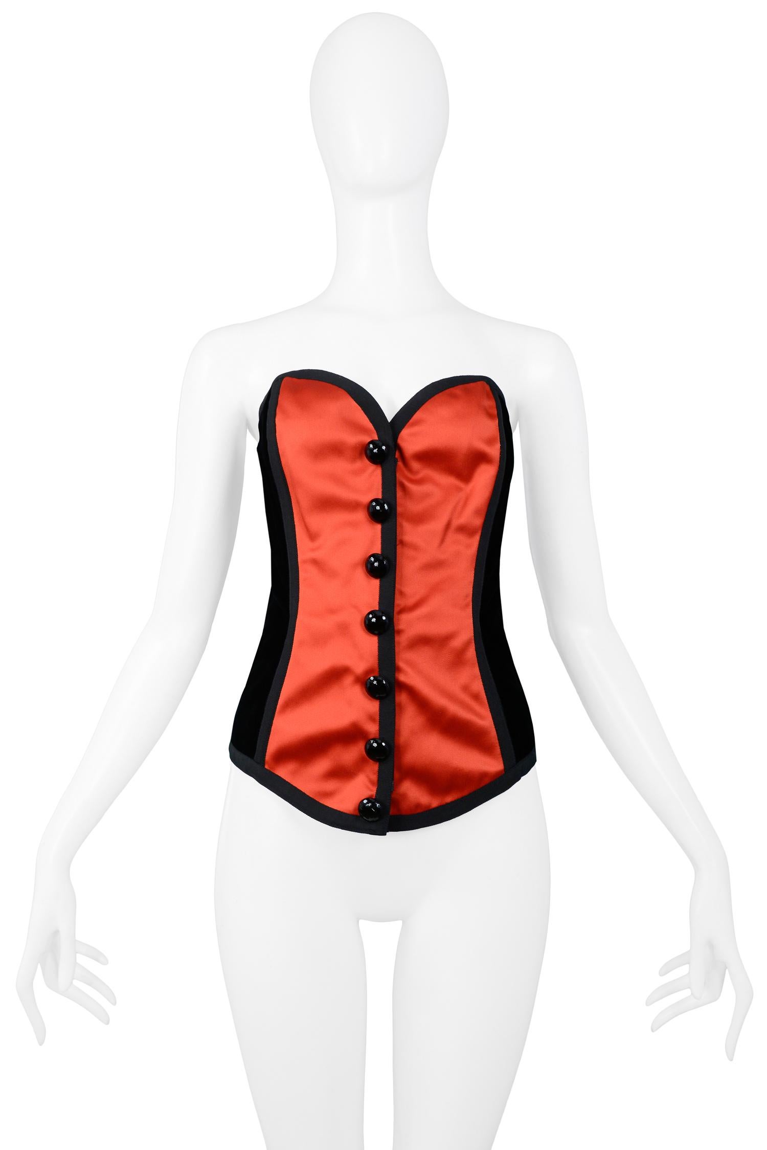 Vintage Yves Saint Laurent red satin & black velvet bustier with decorative faceted button front. Bustier has some stretch for easy fit. 

Excellent Condition.

Size: 38