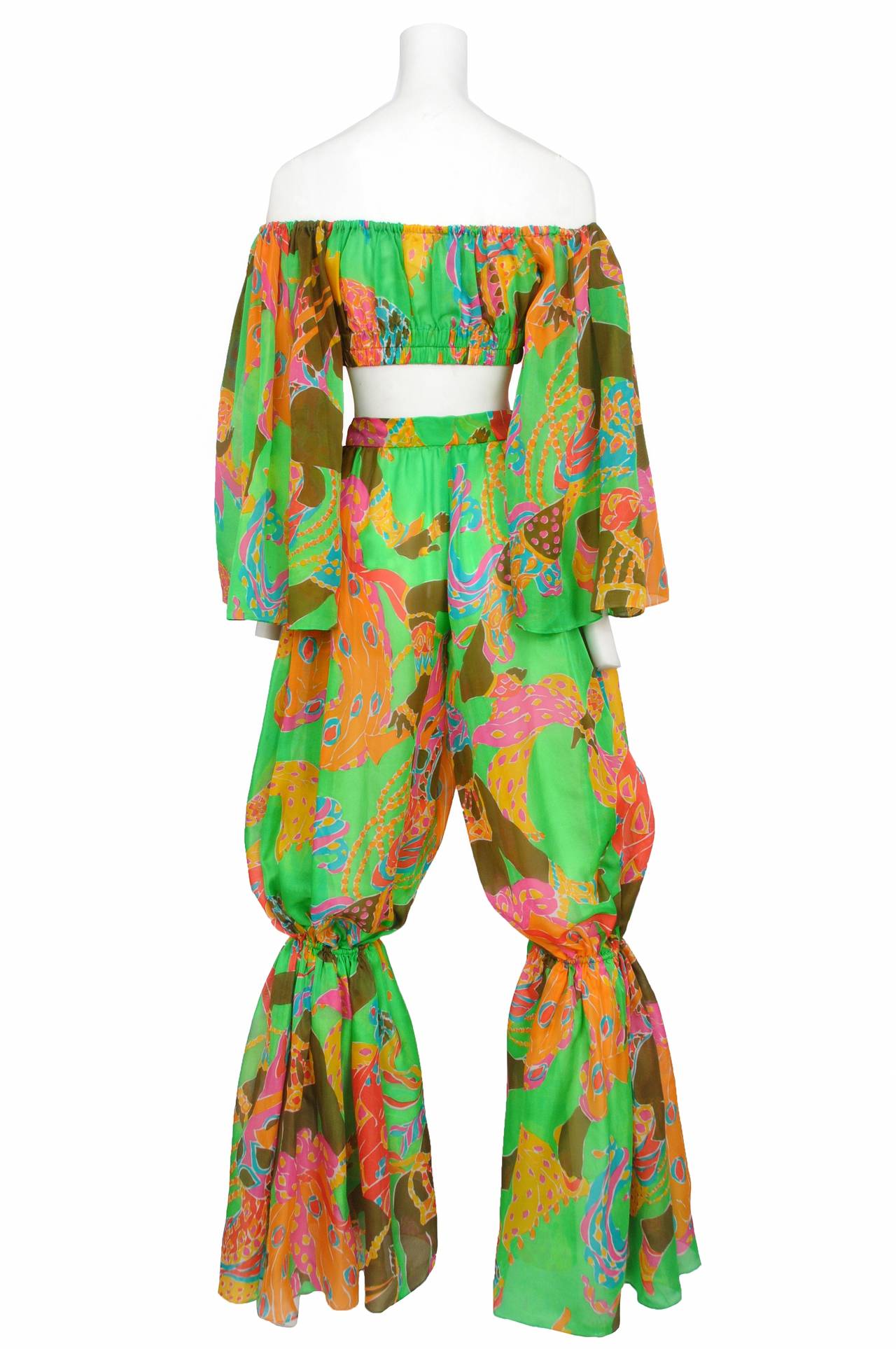 Vintage Yves Saint Laurent acid green psychedelic Ballets Russes 'Arabian Nights' print two peice silk organdy ensemble. The ensemble features a silk organdy crop top with elastic neckline and waistband and features large bell sleeves. The ensemble