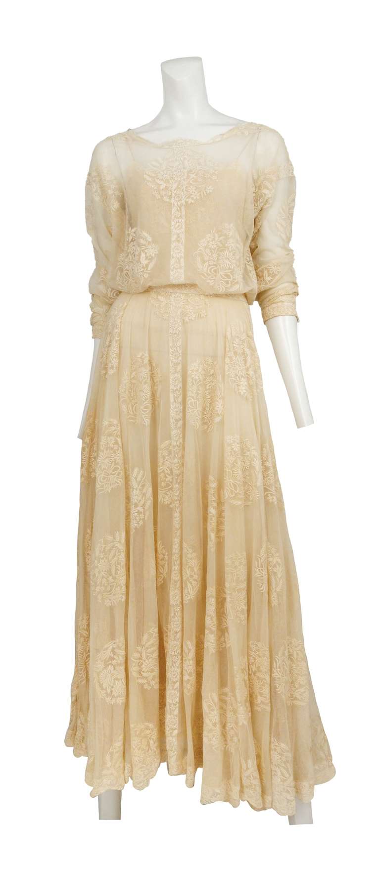 Beautiful Chanel off white lace floor length gown with 3/4 sleeve and gentle pleating.