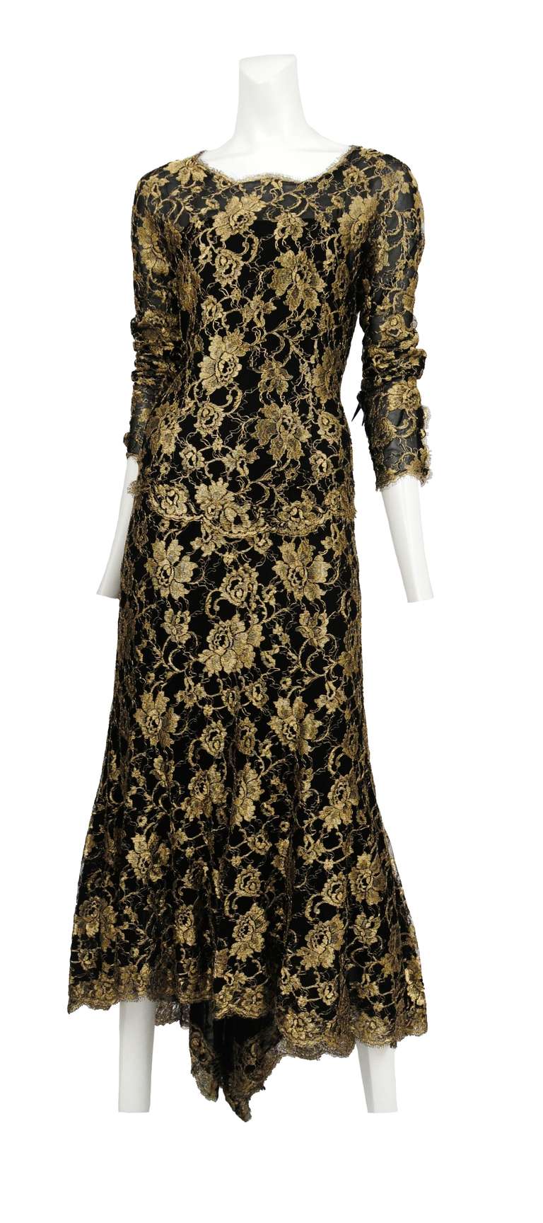 Gold and Black floral lace long sleeve gown with scalloped hem full skirt and fitted bodice.