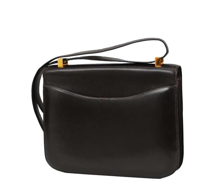 23cm Box calf Hermes Constance in deep chocolate brown with gold hardware.