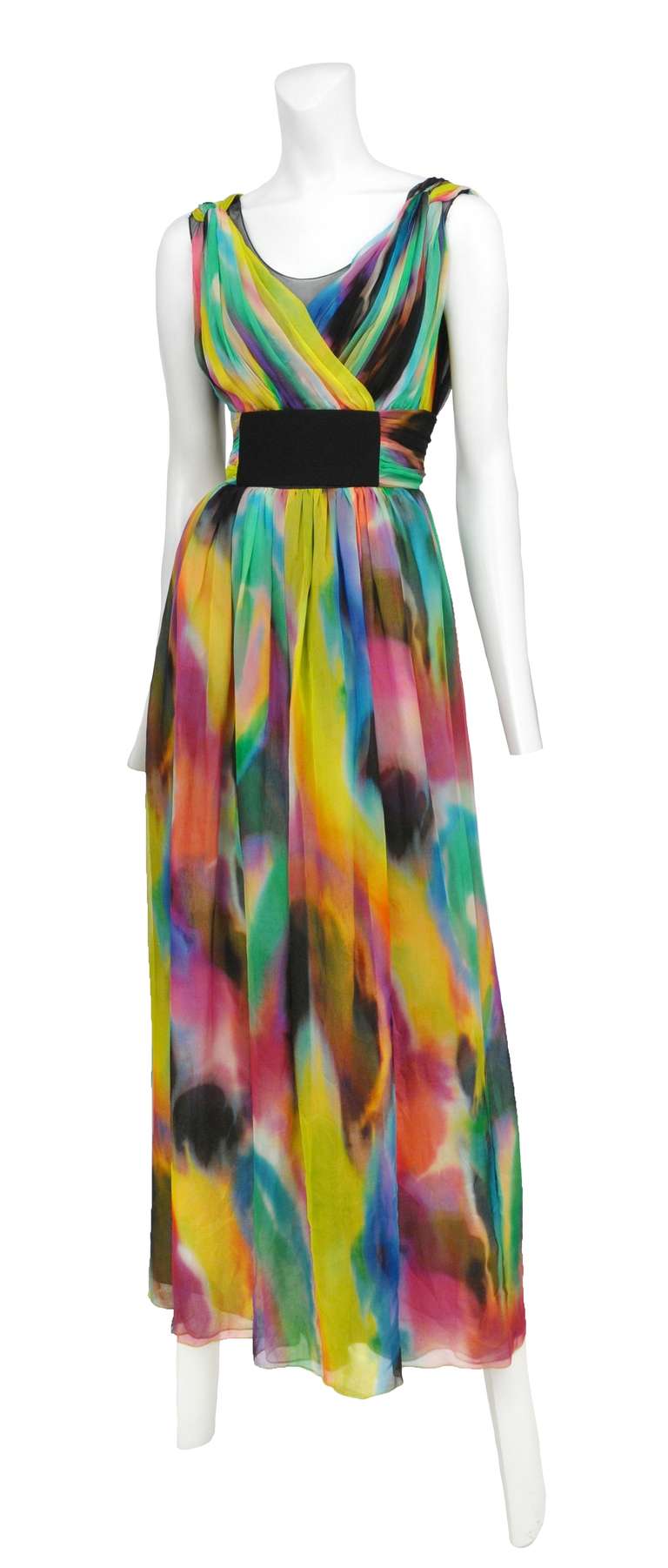 Dolce and Gabanna multi colored tye-dye empire waist gown with wide elastic band and light pleating. Fully lined in silk with exposed back zipper.