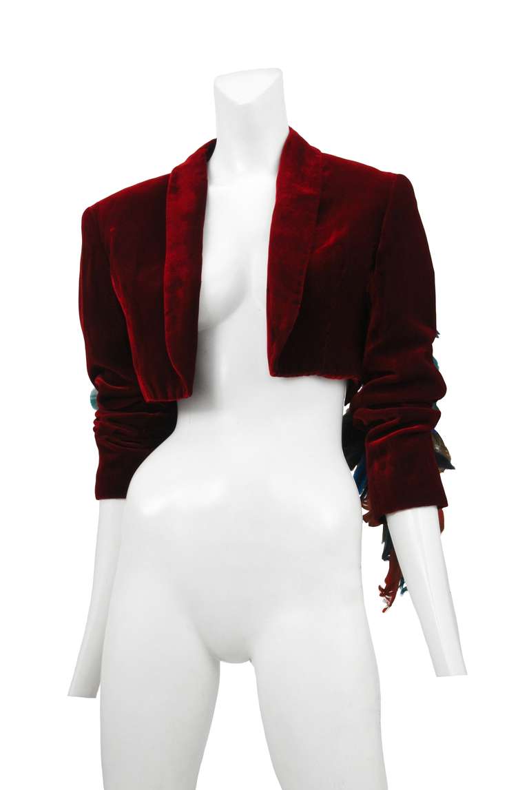 Ozbek red velvet cropped jacket with multi color feather fringe.