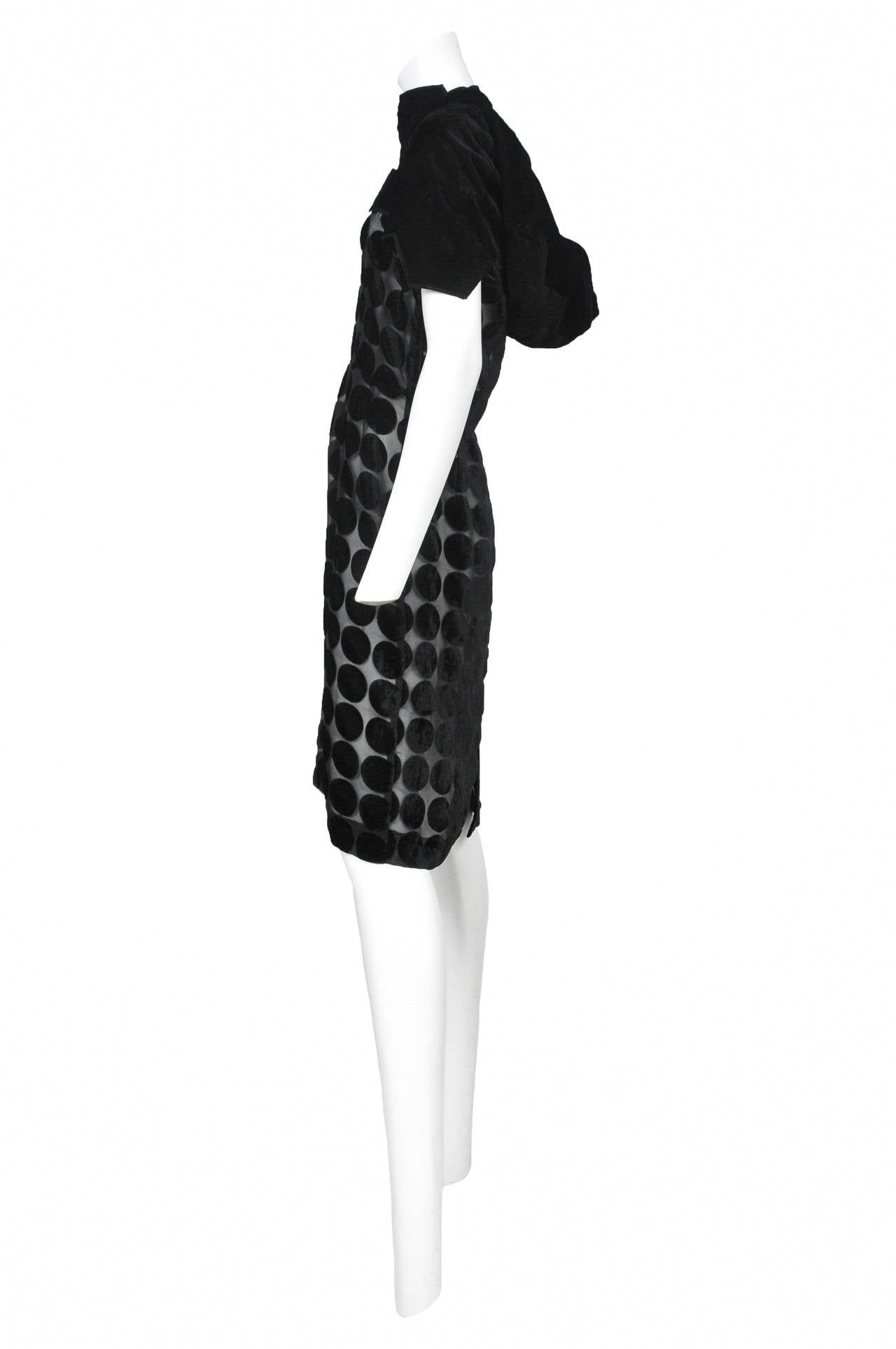 Vintage Junya black velvet and chiffon dress featuring an all over polka dot design, and velvet patch work around the shoulders and hood. From the Spring 2009 Collection.