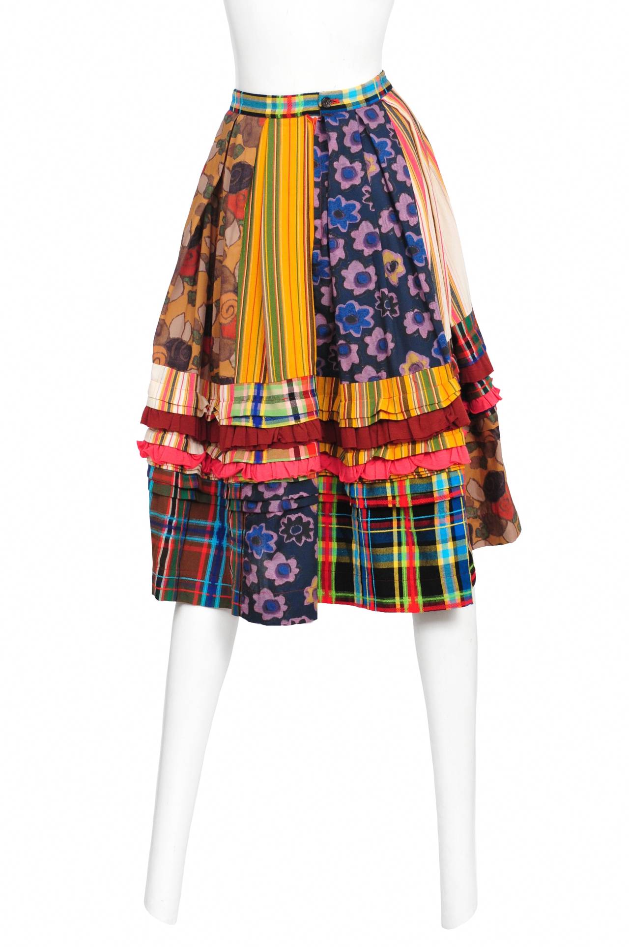 Vintage Comme des Garcons skirt featuring various tiers of patchwork printed fabric with ruffles in between.