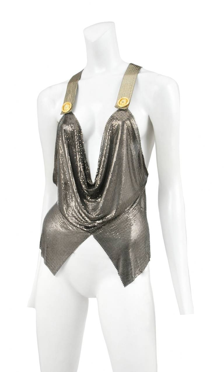 Pewter color metal chain mail cowl neck top w/ criss cross straps backless detail and medallions.