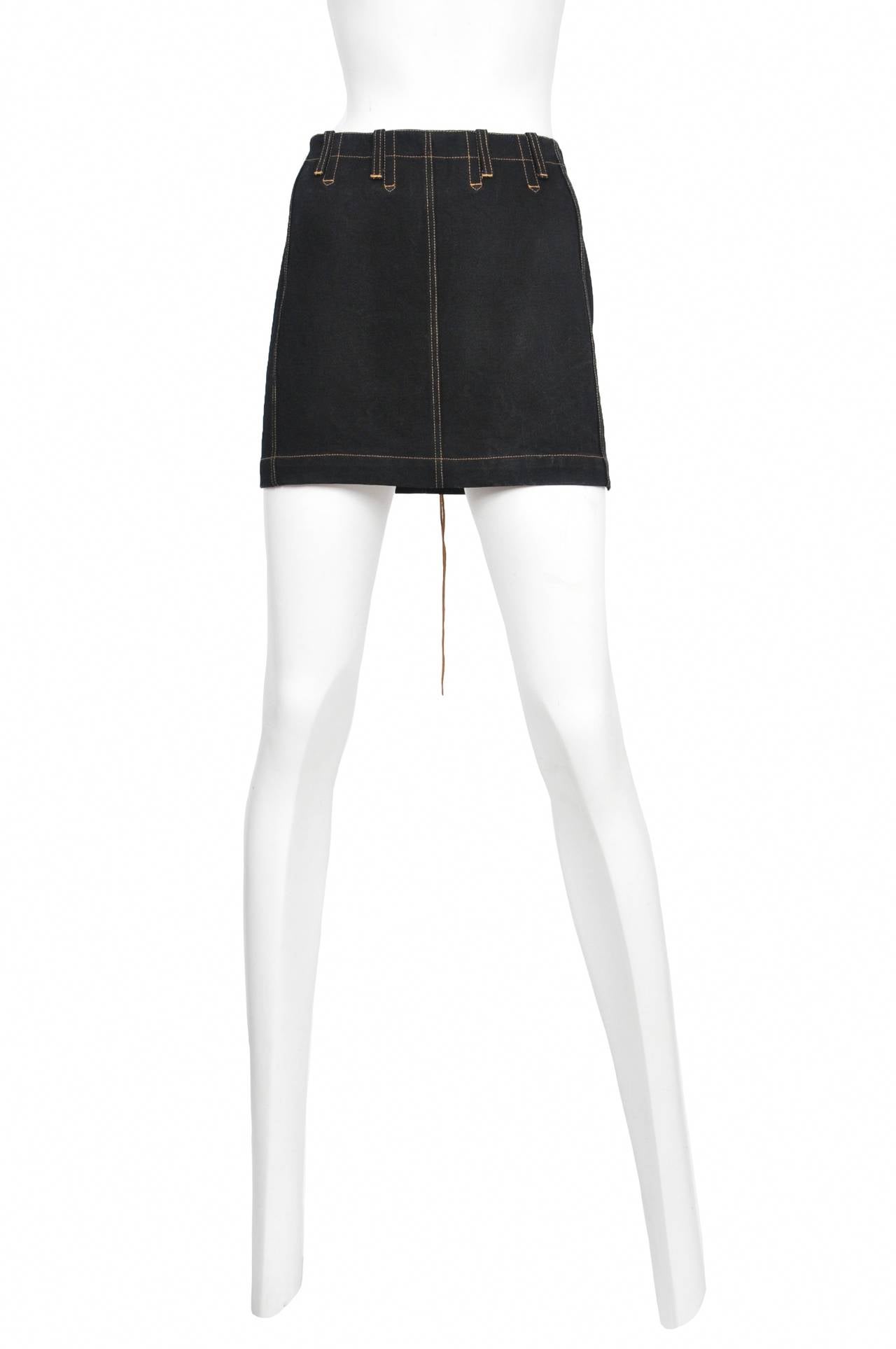 Vintage Azzedine Alaia denim mini skirt featuring stitching details and a lace up back
