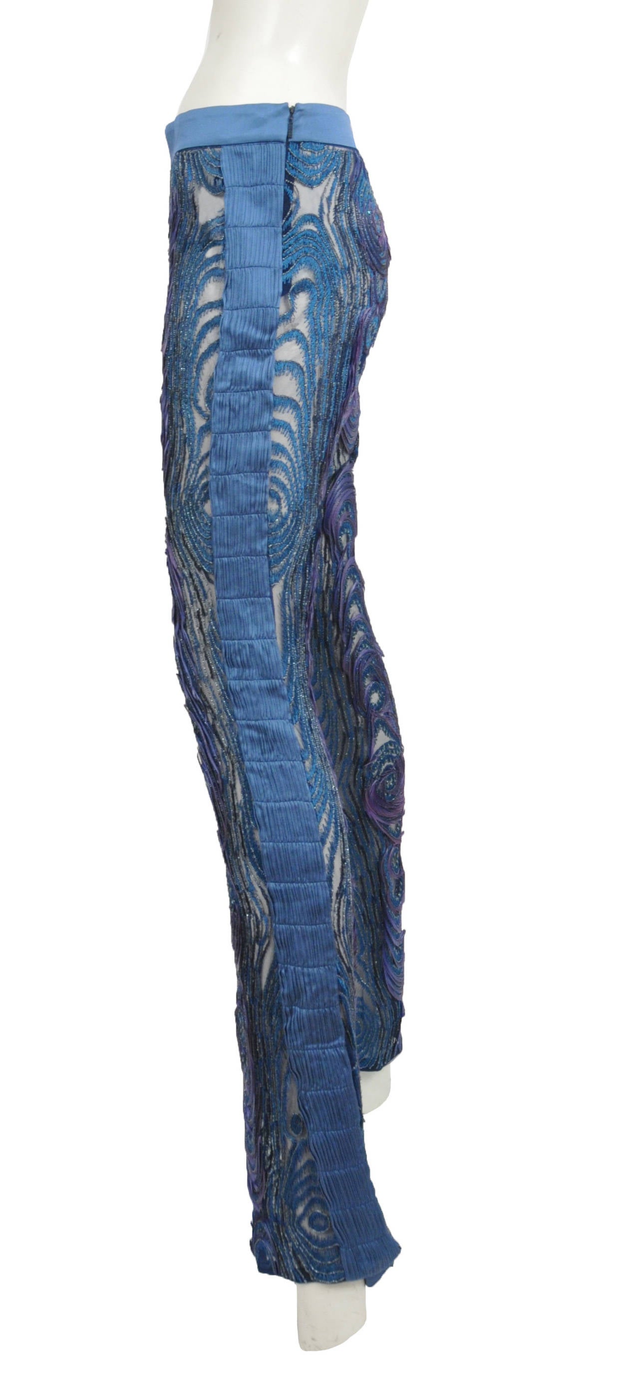 Vintage Tom Ford for Gucci blue and purple beaded and embroidered mesh pants.  The pants feature detailed bead work, embroidery, and feathers and are made up of a satin/cotton blend.
Circa 2004.