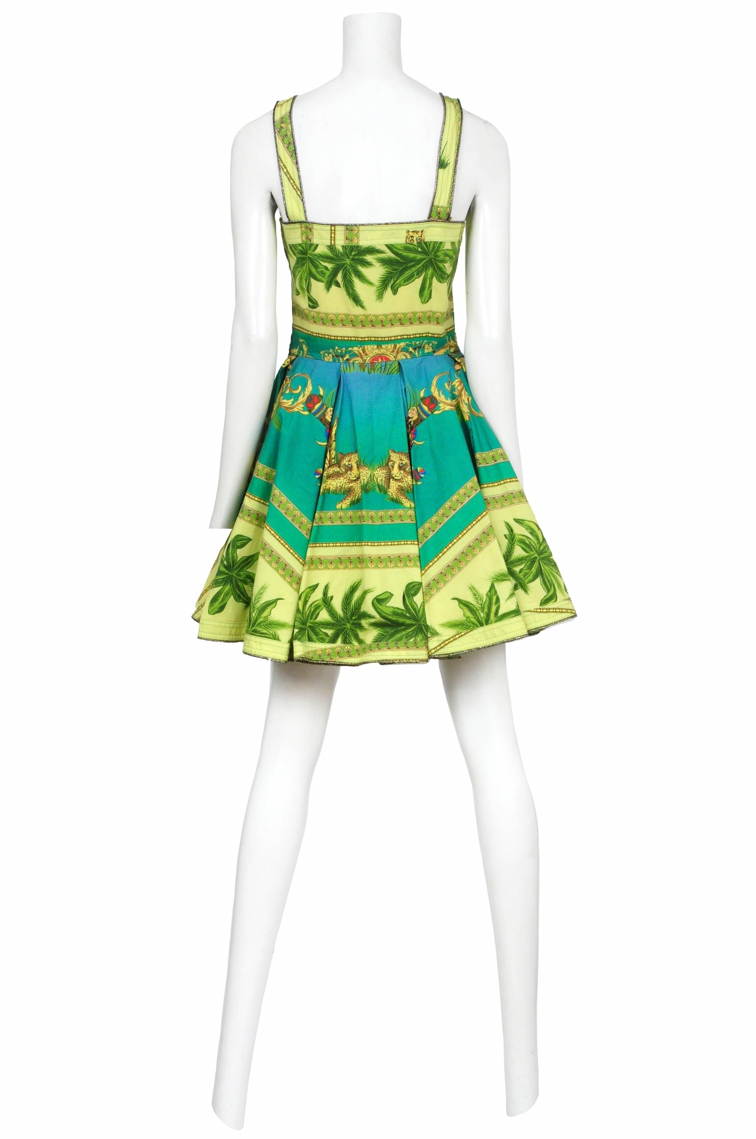 Vintage Versace green and turquoise palm tree print sun dress featuring straps connecting the chest and a fitted box pleated waist.