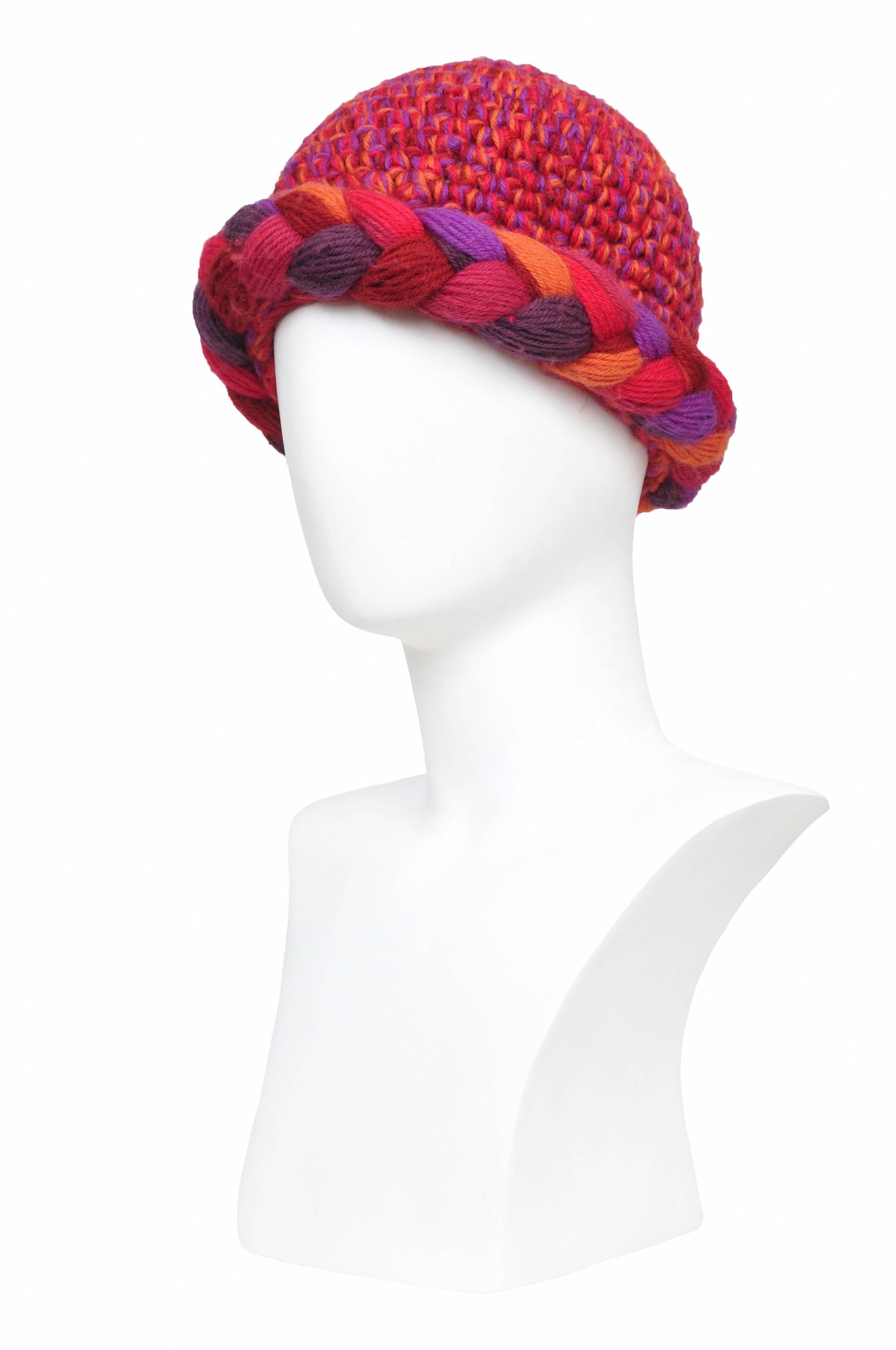 Vintage Yves Saint Laurent knit hat featuring braided pink, red and purple yarn around the edge.