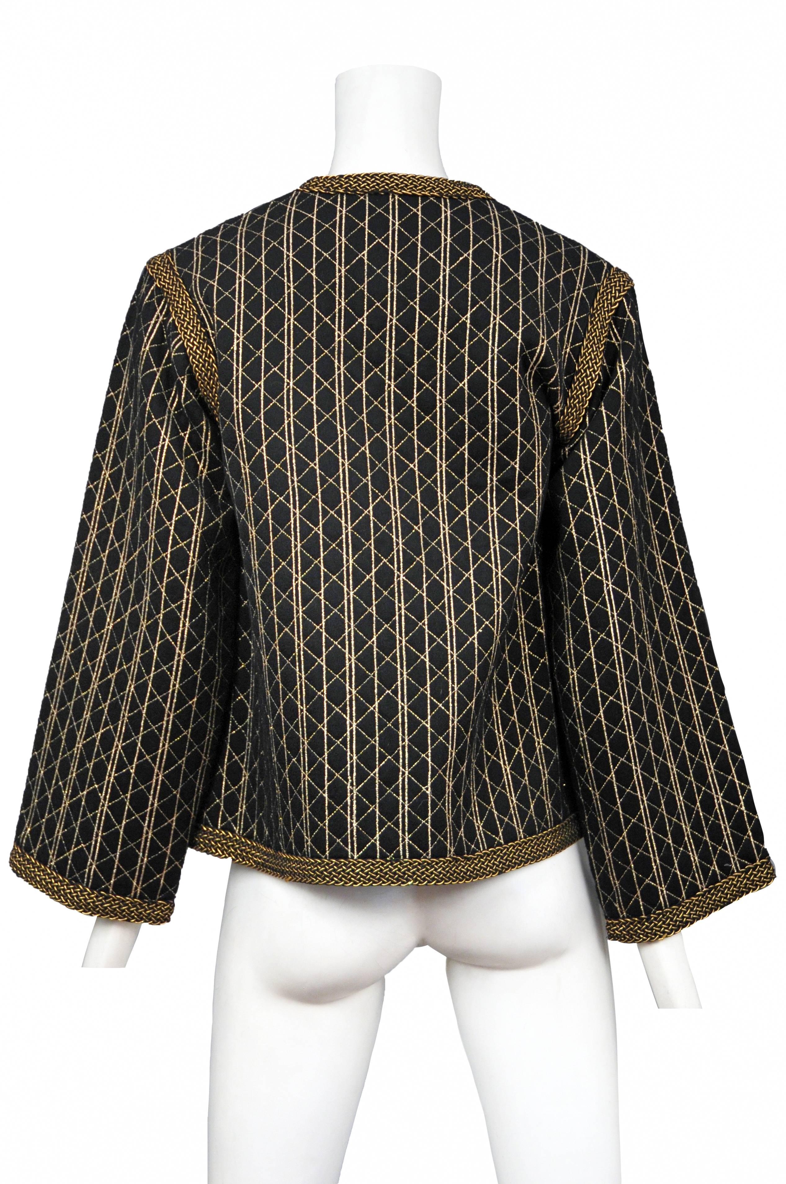 Vintage Yves Saint Laurent black quilted button front jacket featuring gold quilted stitching throughout and gold braided trim along the edges and shoulder seams.
