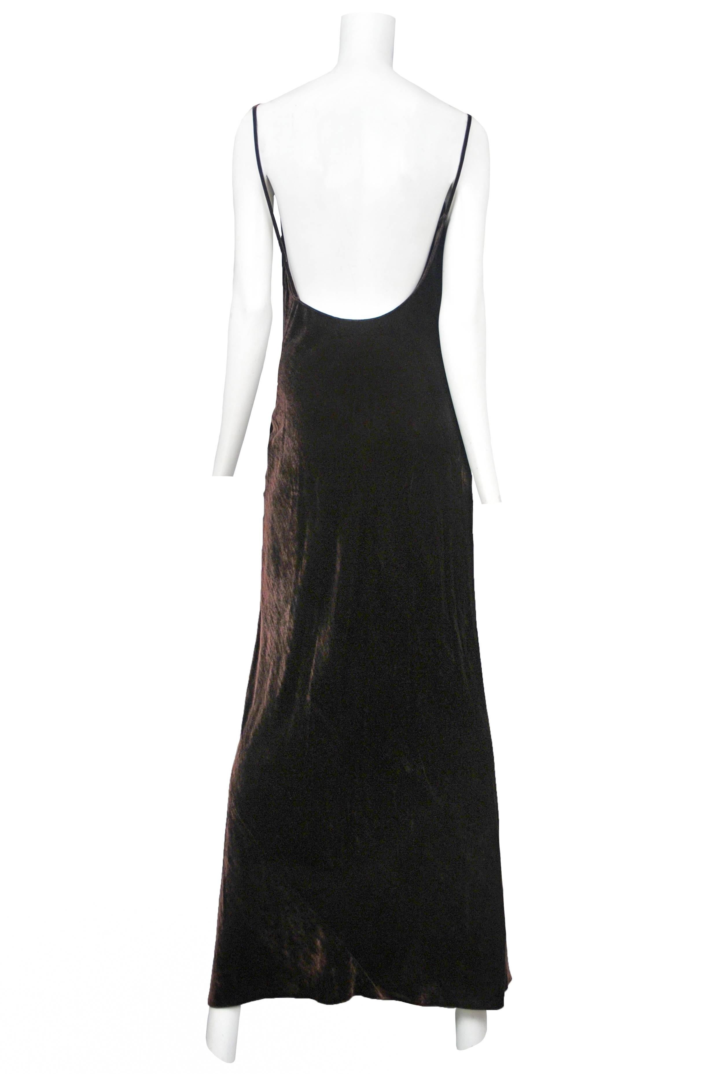 Vintage Donna Karan dark brown bias cut velvet gown featuring spaghetti straps, a cowl neckline and an open back.
