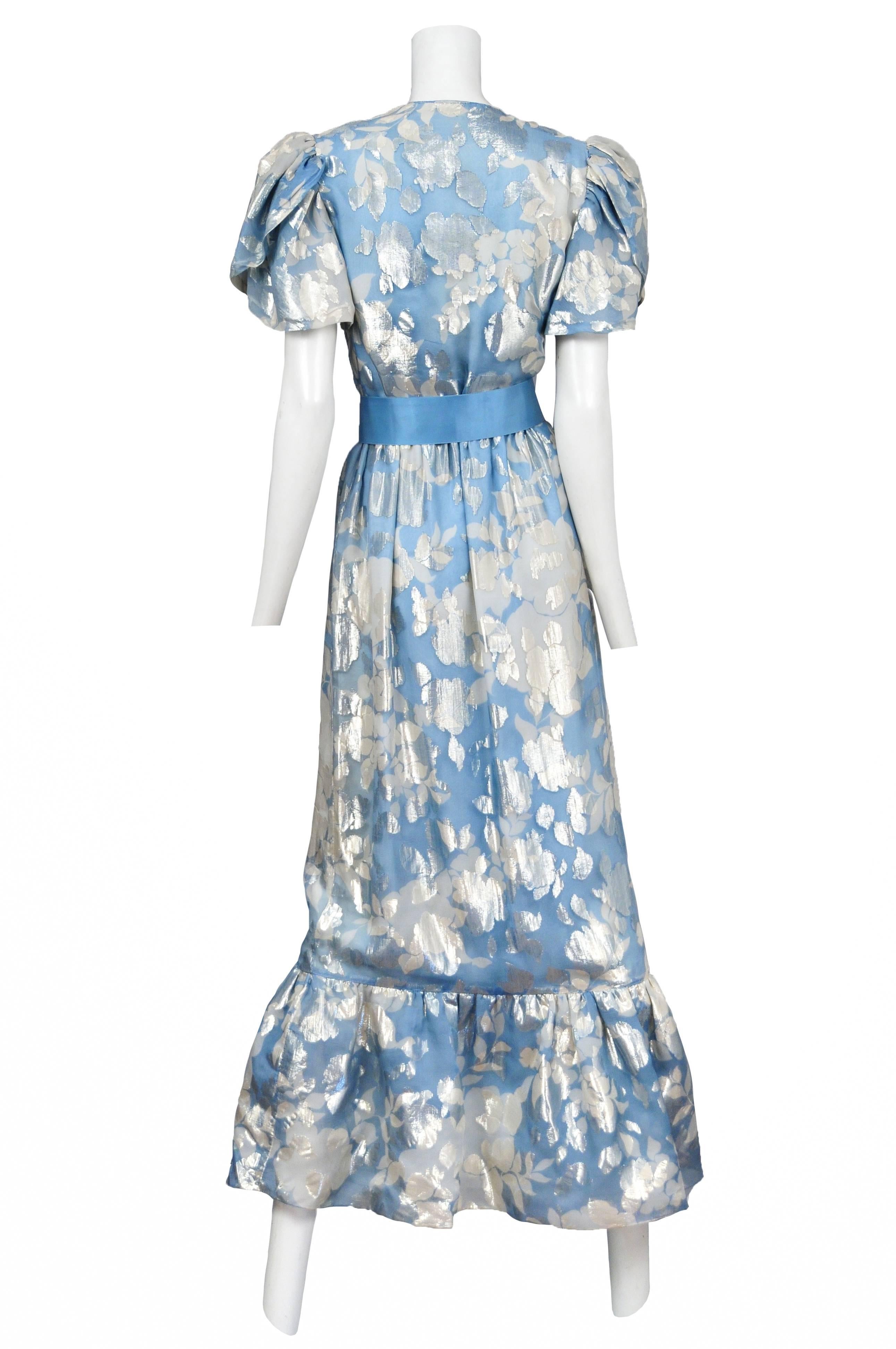 Vintage Hanae Mori blue and silver metallic floral gown featuring puffed short sleeves, an overlap neckline, a flounce at the hem and a matching blue satin ribbon belt.