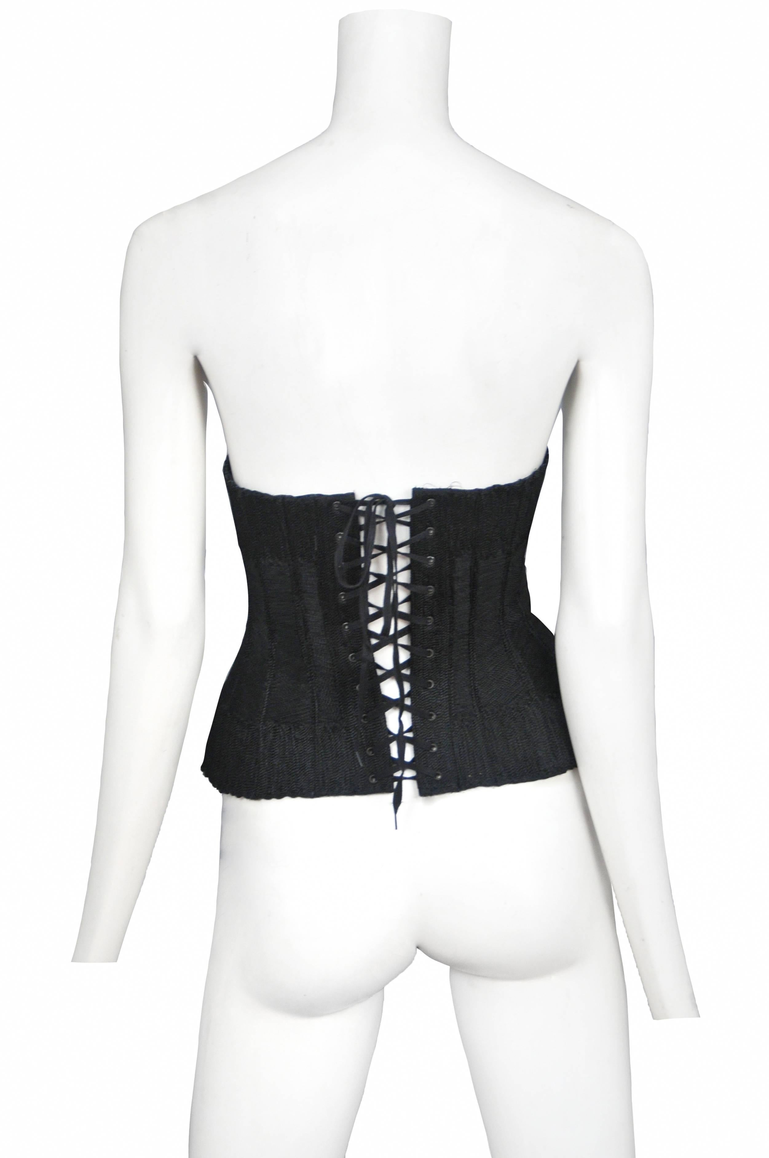 Vintage Jean Paul Gaultier black thread embroidered corset featuring a zipper entrance at the front, boning, and lace up detailing at the back.