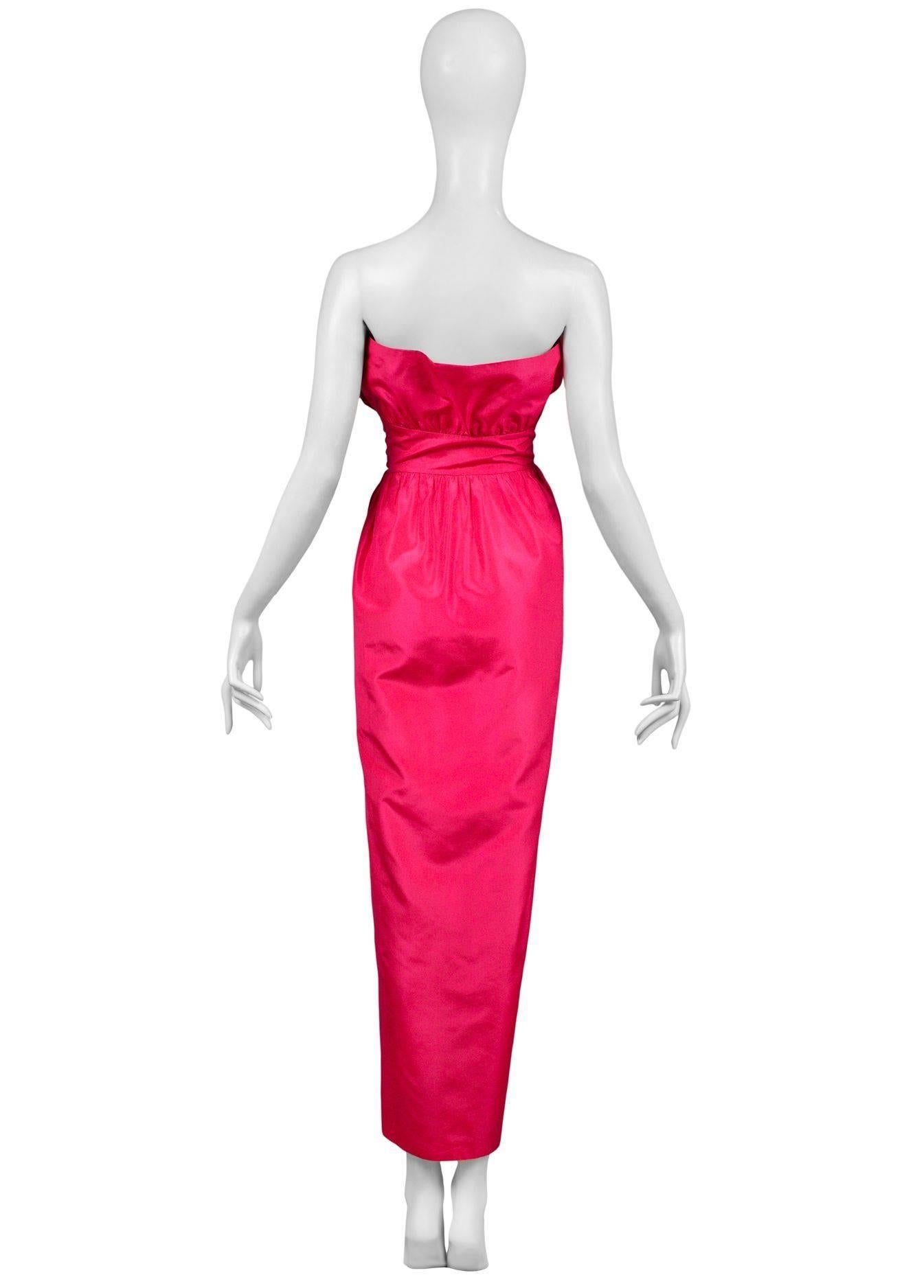 Vintage Lanvin fuchsia taffeta strapless gown featuring a fitted side button waist, tulip style skirt, and gathering below the bust and above the waist to give the bust it's petal like shape. 