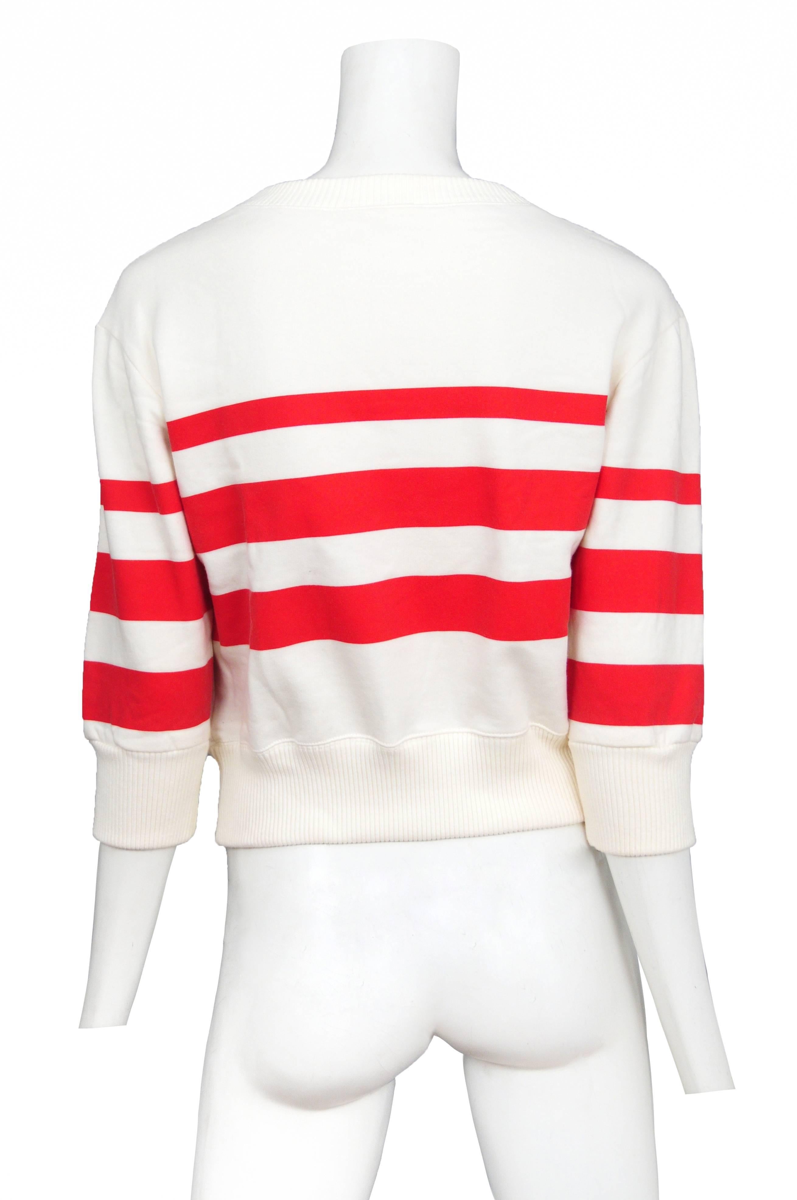 Vintage Chanel Pop Art sweatshirt featuring red and white striped sleeves and a multicolor print of Coco Chanel on the front with a thought bubble reading 
