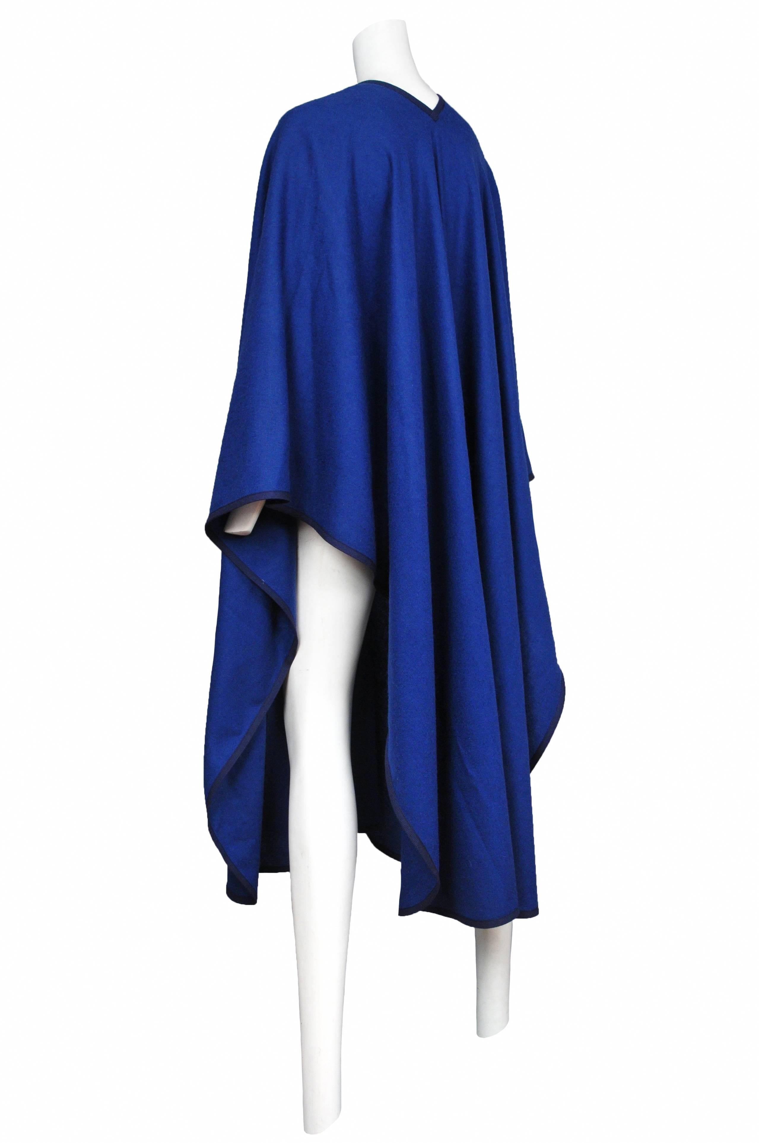 Vintage Yves Saint Laurent blue soft knit wrap featured navy binding around the edges.