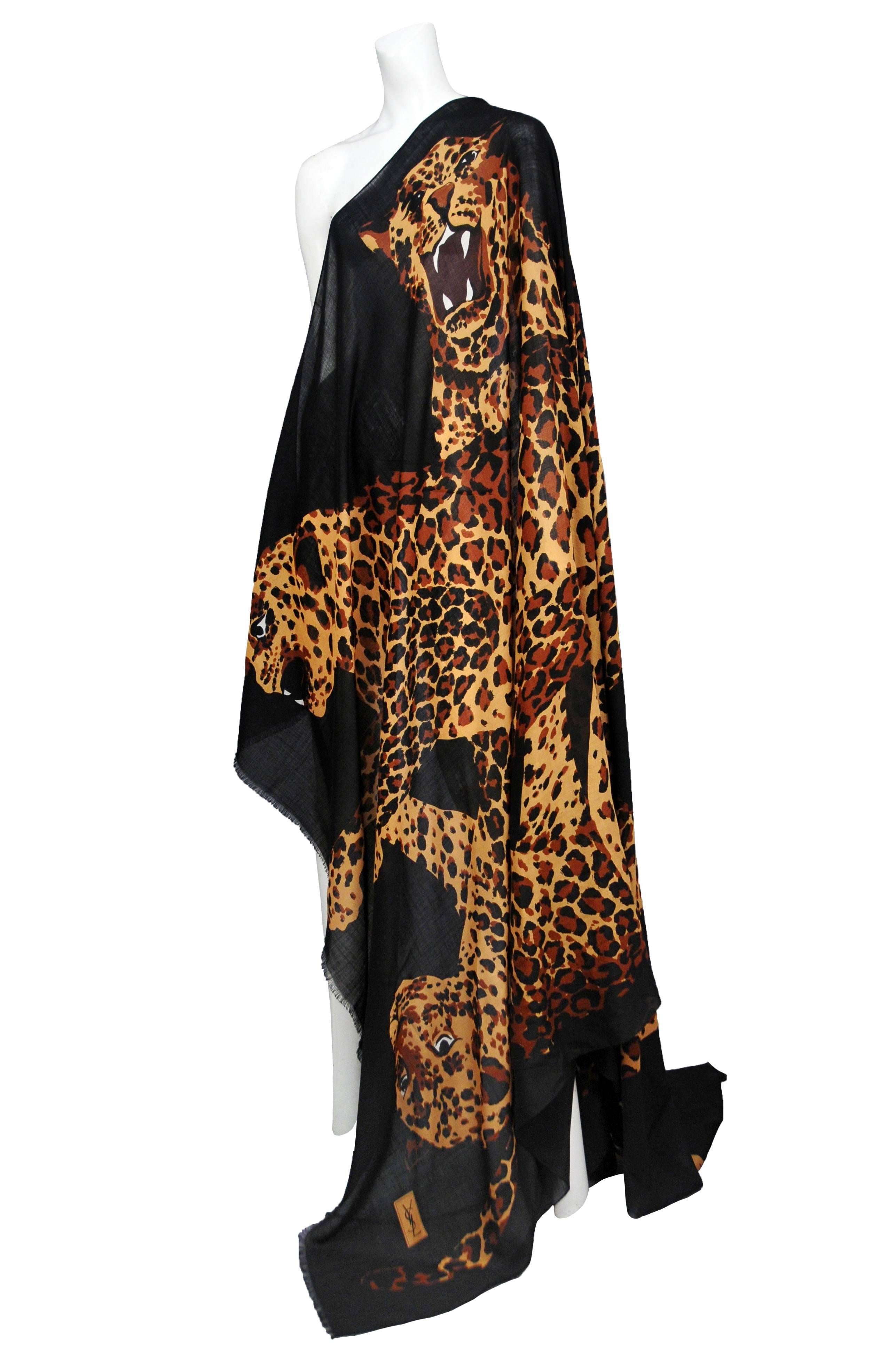 Vintage Yves Saint Laurent wool and silk blend scarf featuring leopards printed on a black background. Circa 1986. Featured in runway show. 