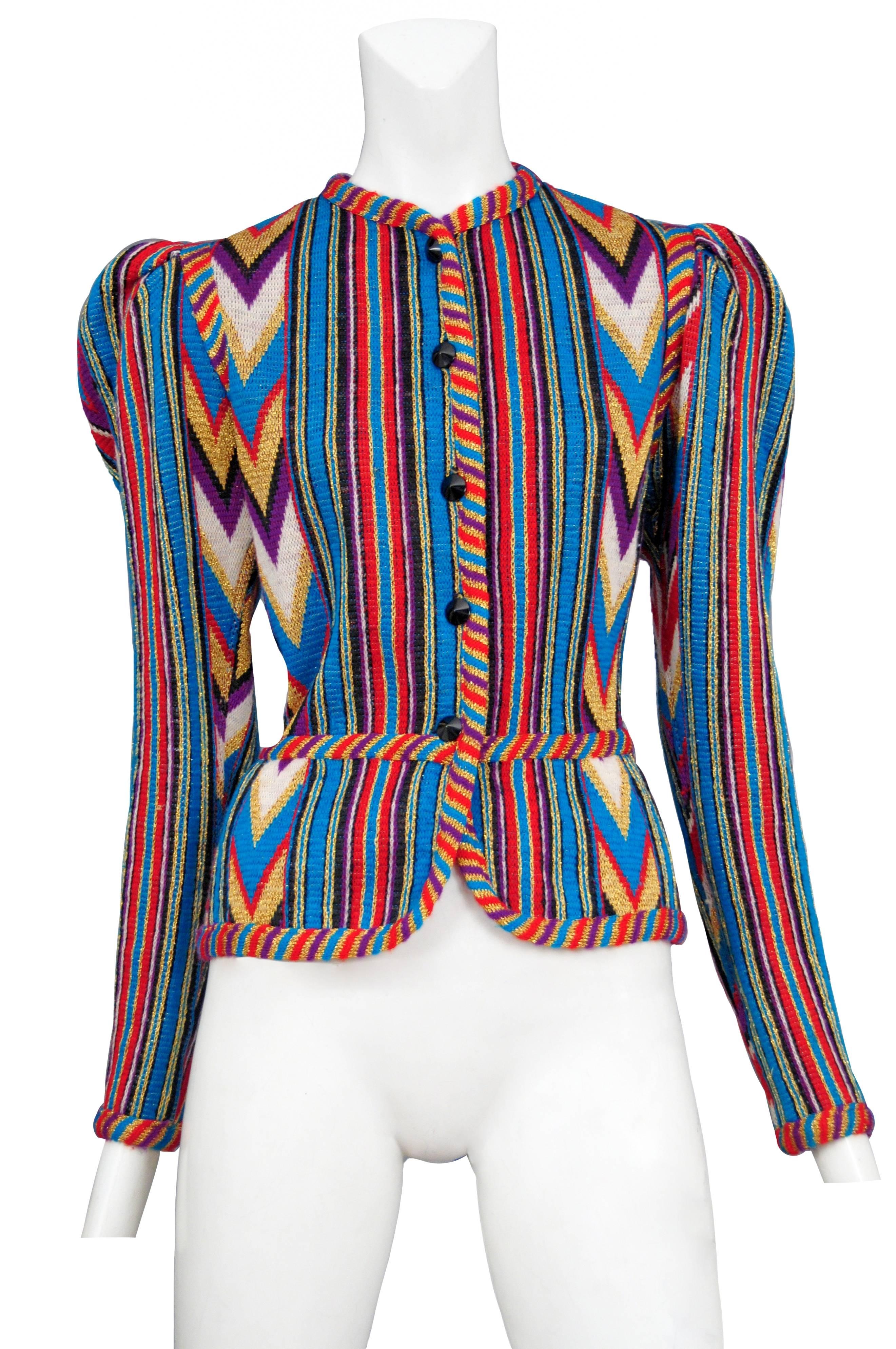 Vintage Yves Saint Laurent button front sweater featuring a Southwestern Navajo style pattern using metallic gold, purple, blue, red and white wool yarn, black buttons along the front closure, gathering at the shoulder seams and braided trim along