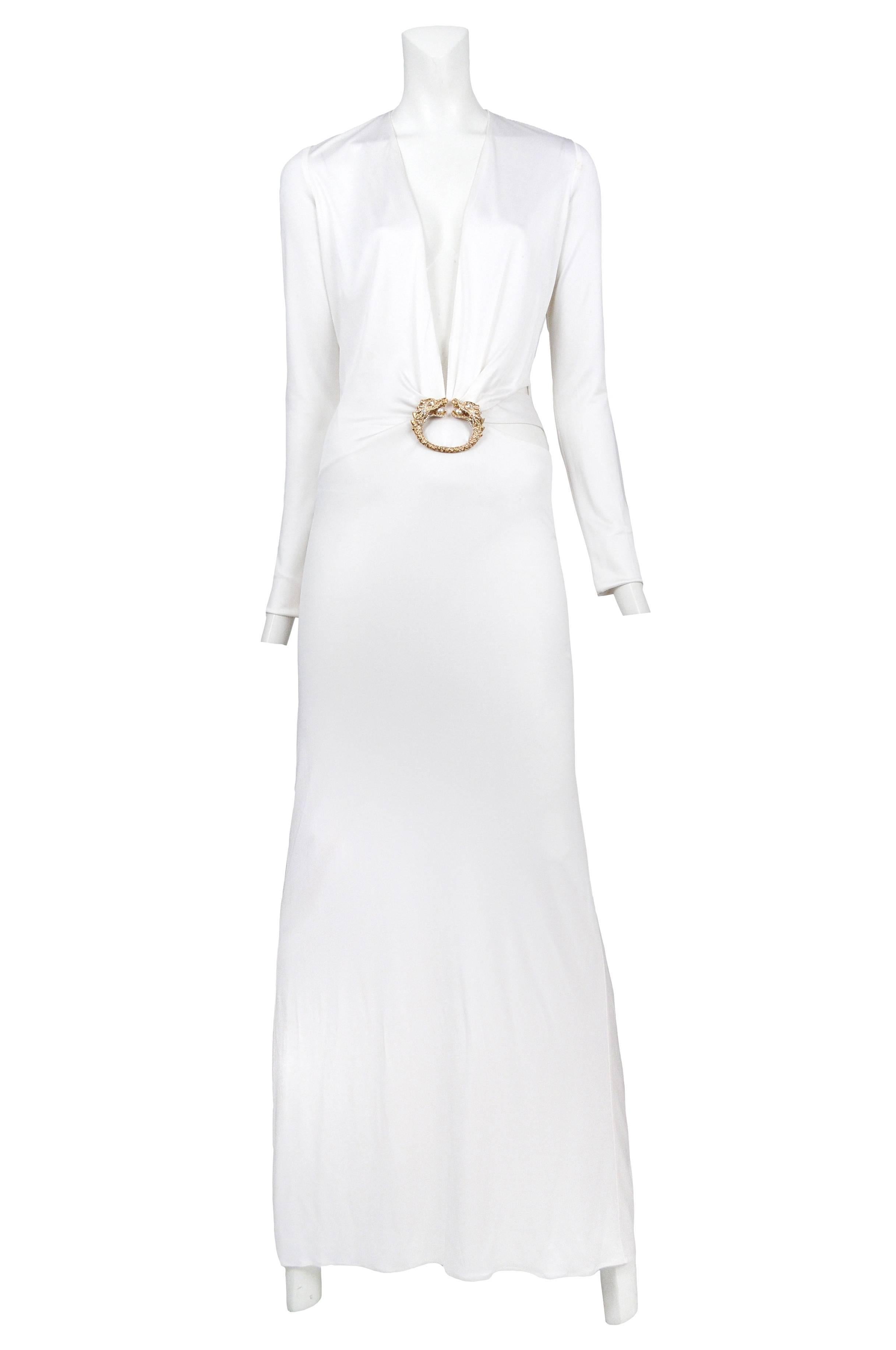 Vintage Tom Ford for Gucci white iconic gown featuring plunging neckline, double headed dragon adornment at center waist and a cutout at hip. Runway piece from the Fall 2004 collection. Please contact for additional photos. 