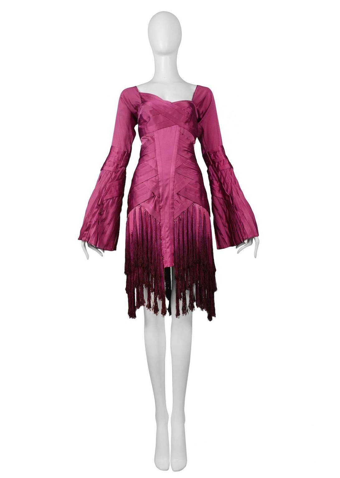 Iconic vintage Tom Ford for Gucci fuchsia silk long sleeve evening dress featuring intricate woven pleating at torso and bust and three tiers of tassels at the skirt. Runway piece from the Fall/Winter 2004 Collection.
