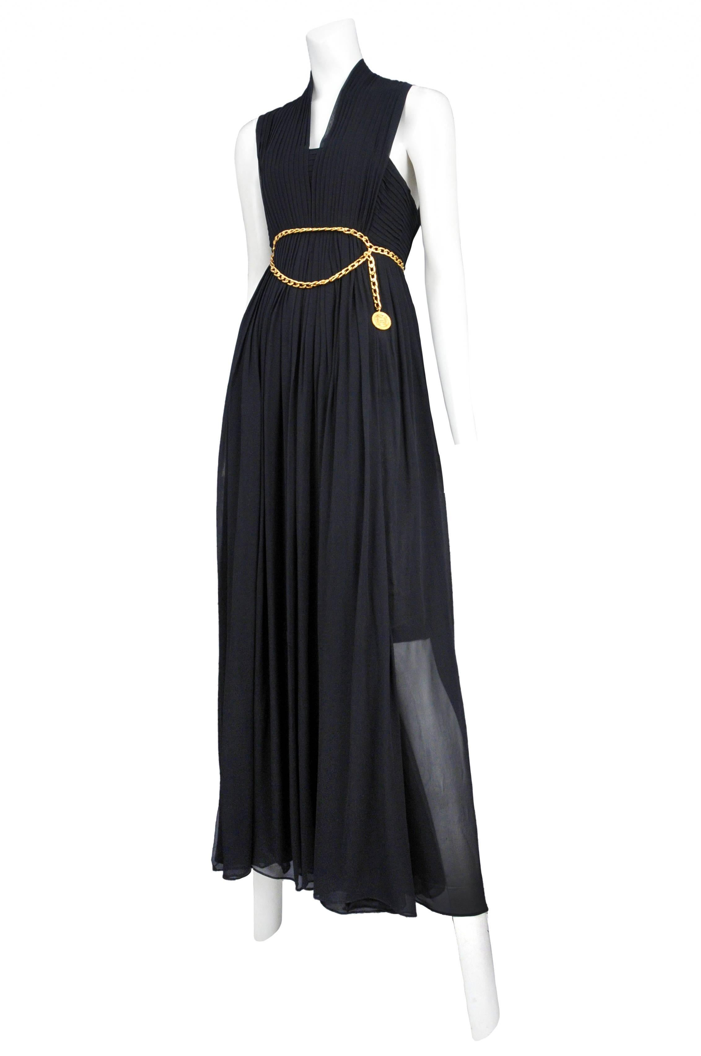 Chanel black chiffon knife pleat gown with flat gold link chain belt detail and open back with tiny gold Chanel buttons, lined with a half slip. 