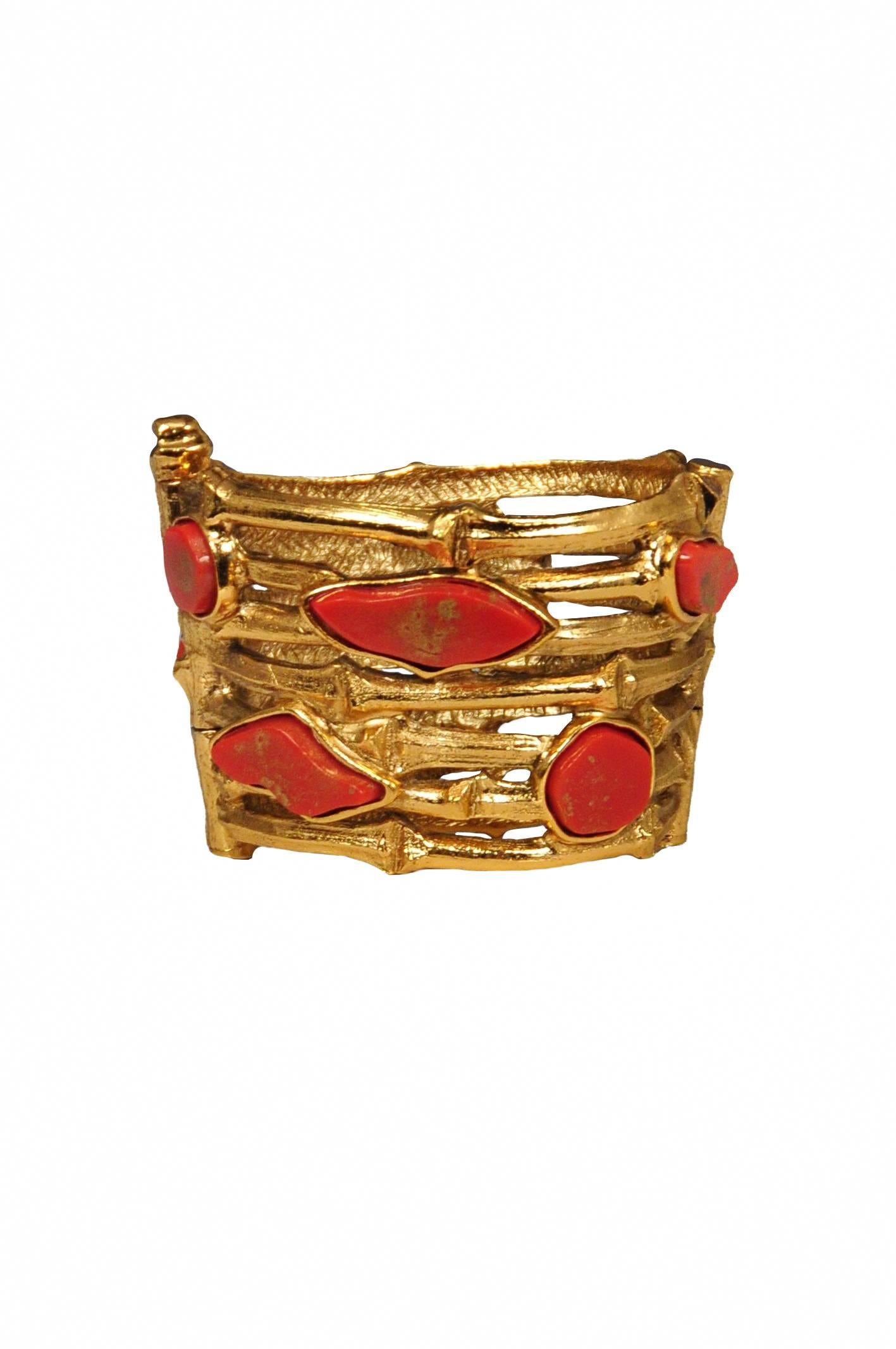 Yves Saint Laurent Rive Gauche gold bamboo wide bangle with coral inlay. Bracelet is wider at base and has 3