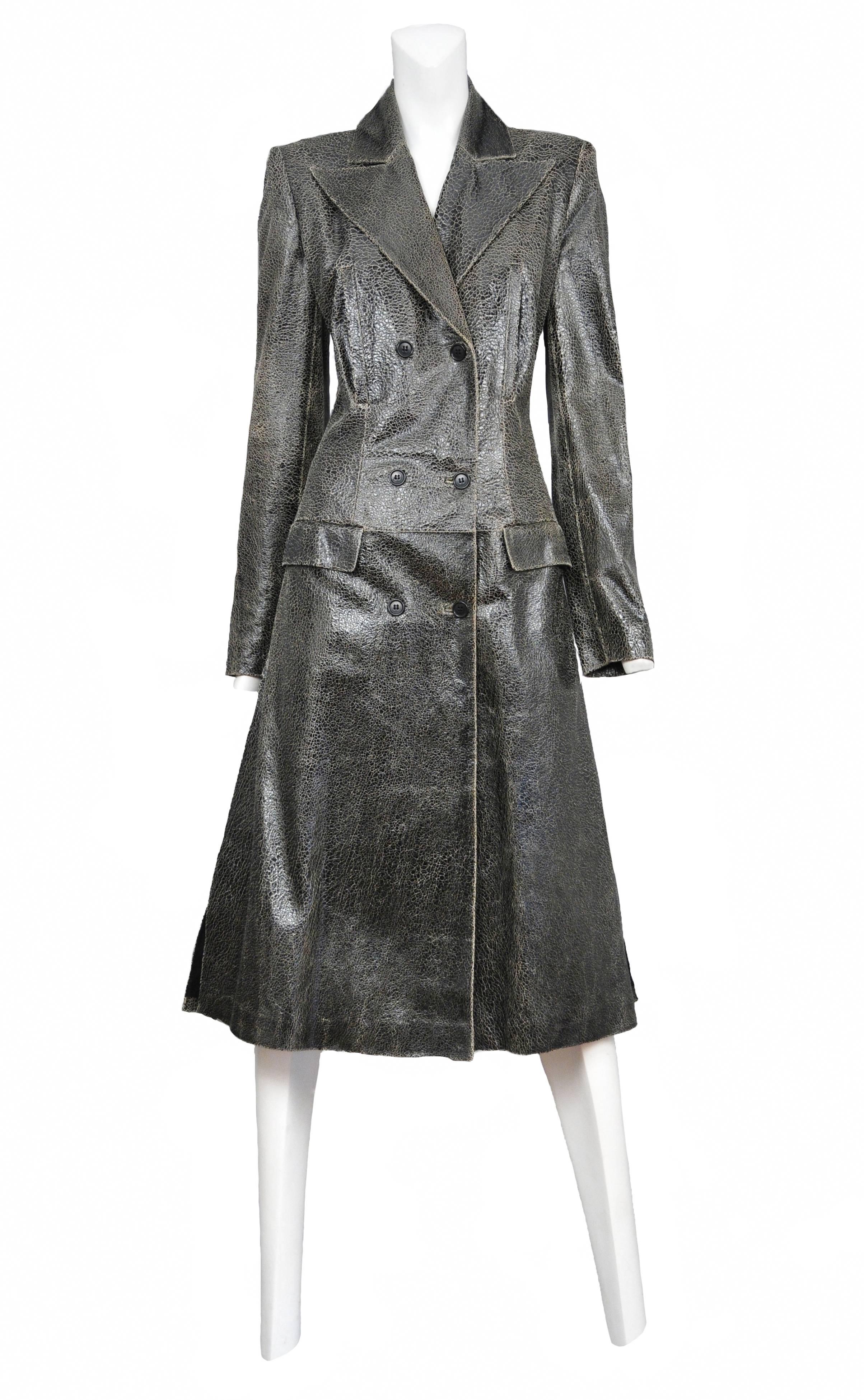 Crackled or distressed black leather double breasted coat with chest pockets. Look #9 1999 AW

Please contact for additional photos or information