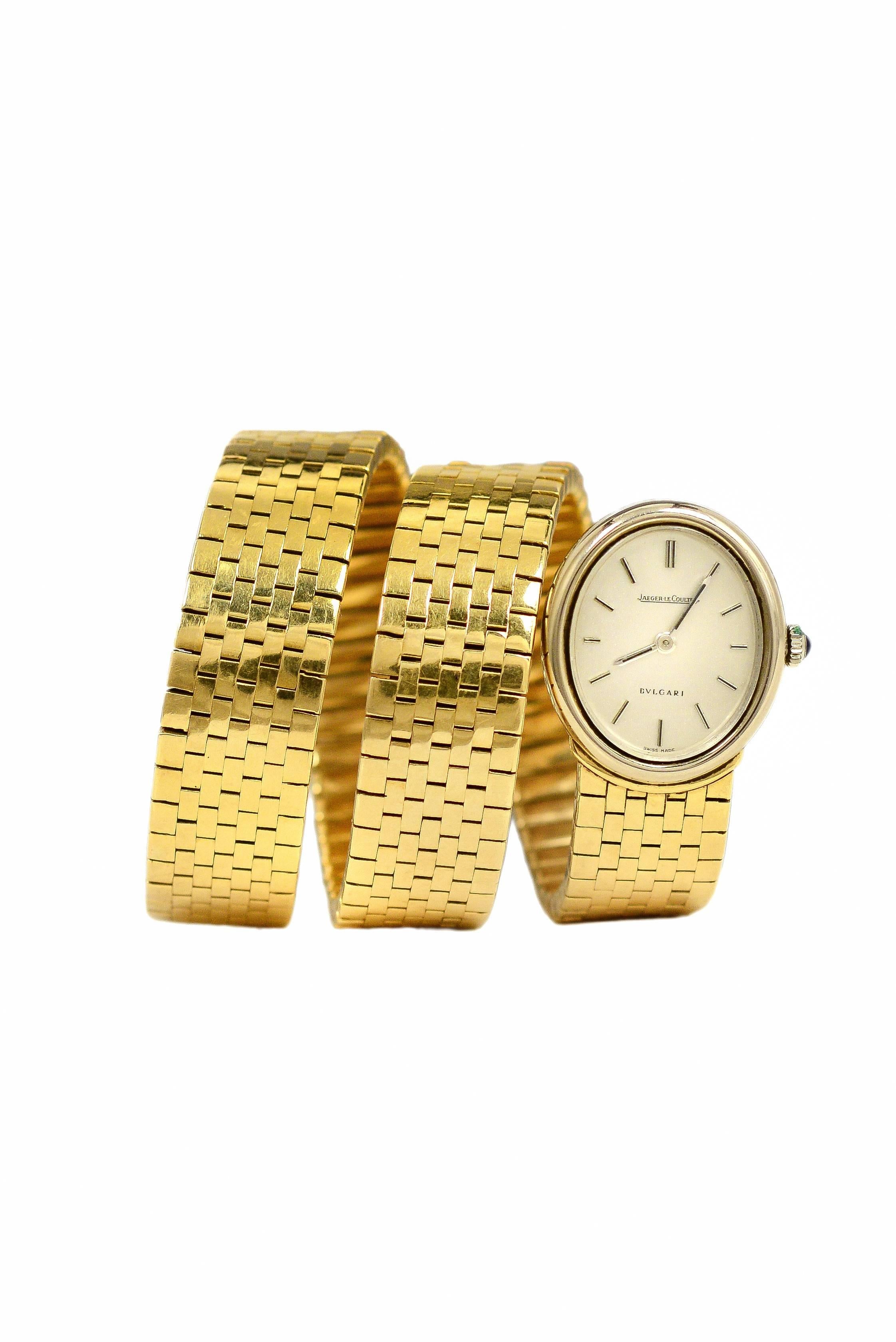 Highly-unusual Bulgari 18K gold snake watch with yellow gold brick-link coil band and large white gold oval case housing Jaeger LeCoultre movement. Stamped with serial number on caseback and BULGARI 750 at tail, dial signed Jaeger LeCoultre and