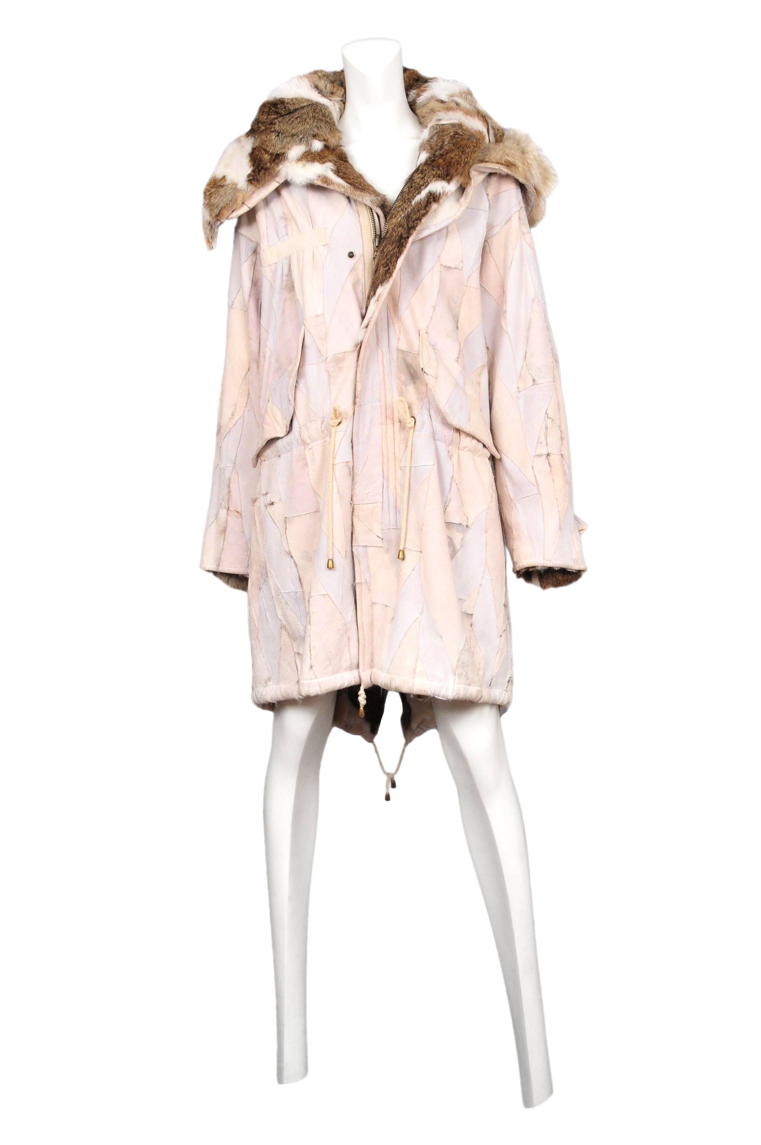 Patchwork rabbit fur coat with drawstring waist and hood. The hood is detachable and has a shape wire in hem. Scanners, AW 2003.

Please contact for additional information or images. 
