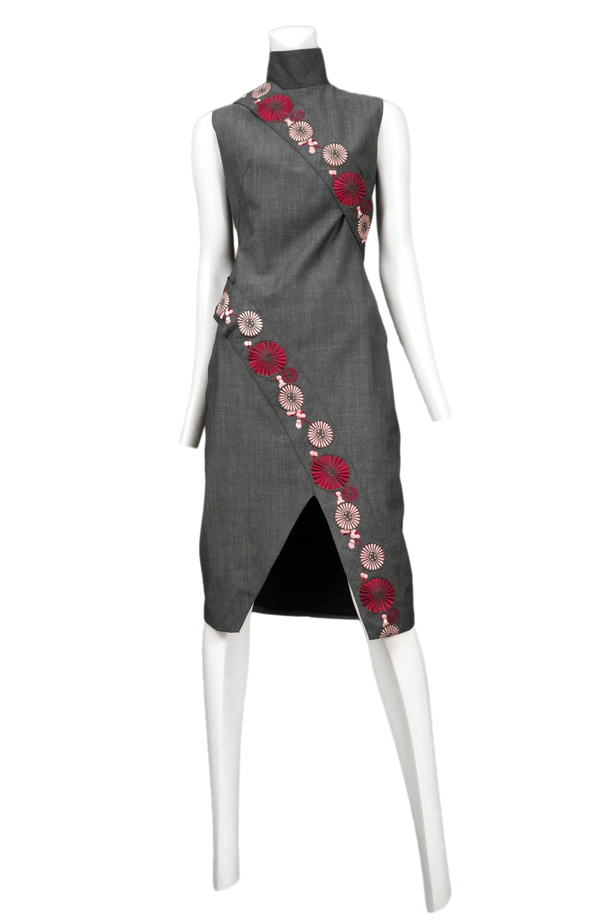 Grey wool chengsom style dress with bands on embroidered flowers. Asymmetrical hem. Voss SS 2001. 

Please contact for additional information and photos.