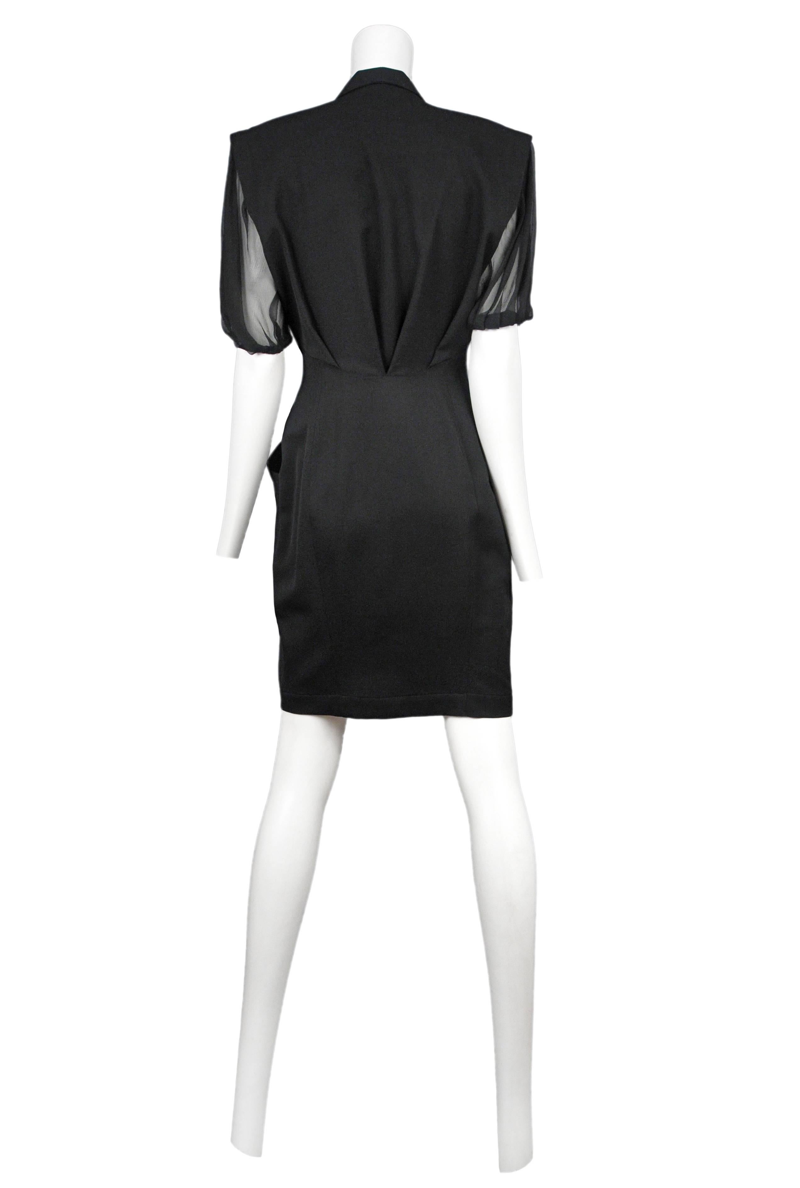 Thierry Mugler black chiffon structured dress with chiffon insets. Dress has deep pockets in front and plunging neckline. 