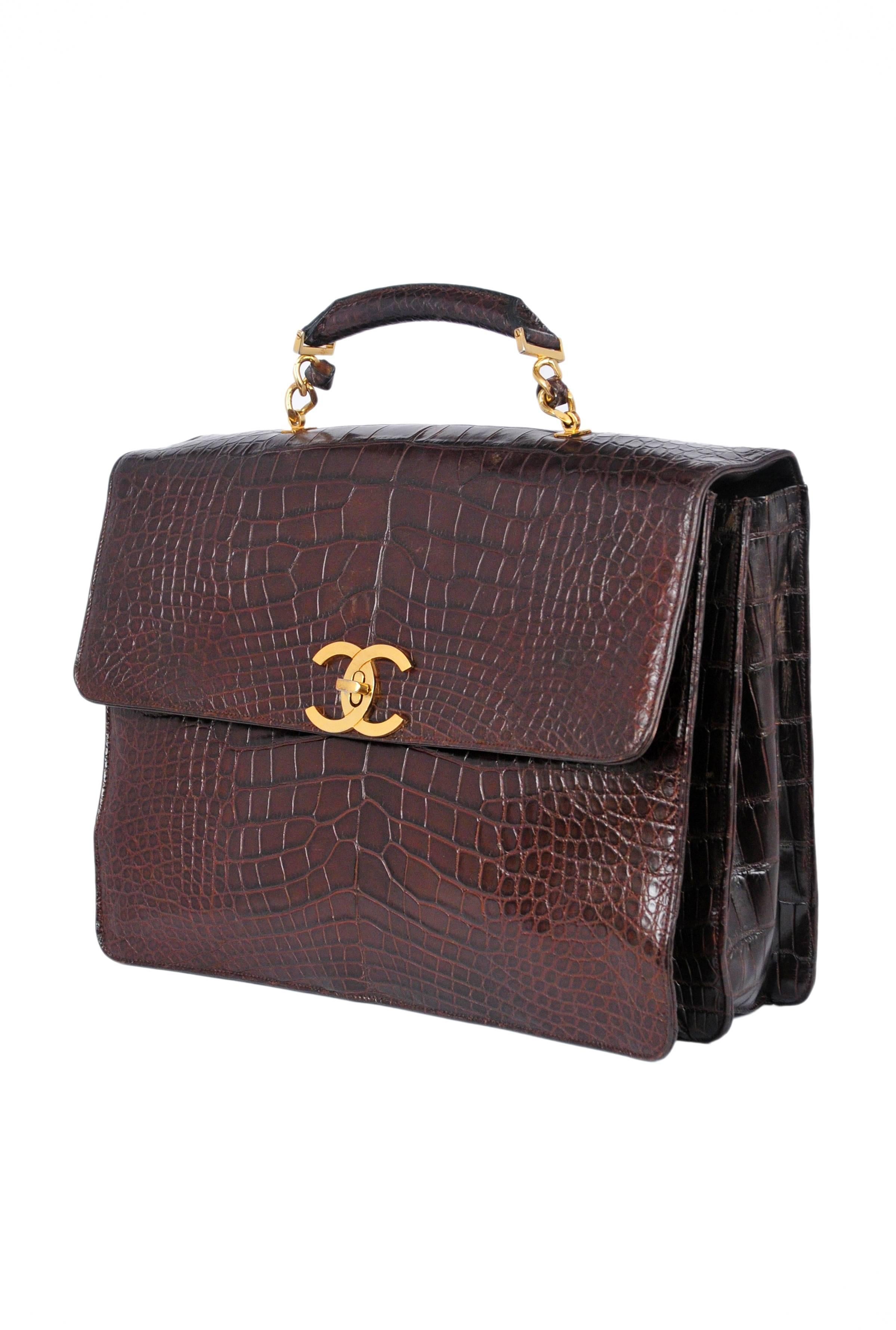 Chanel chocolate brown crocodile skin briefcase bag with gold chain top handle. Gold plated CC turn clasp open up to three compartments with two inside zipper pockets. Lined in dark brown leather. Truly beautiful. 
