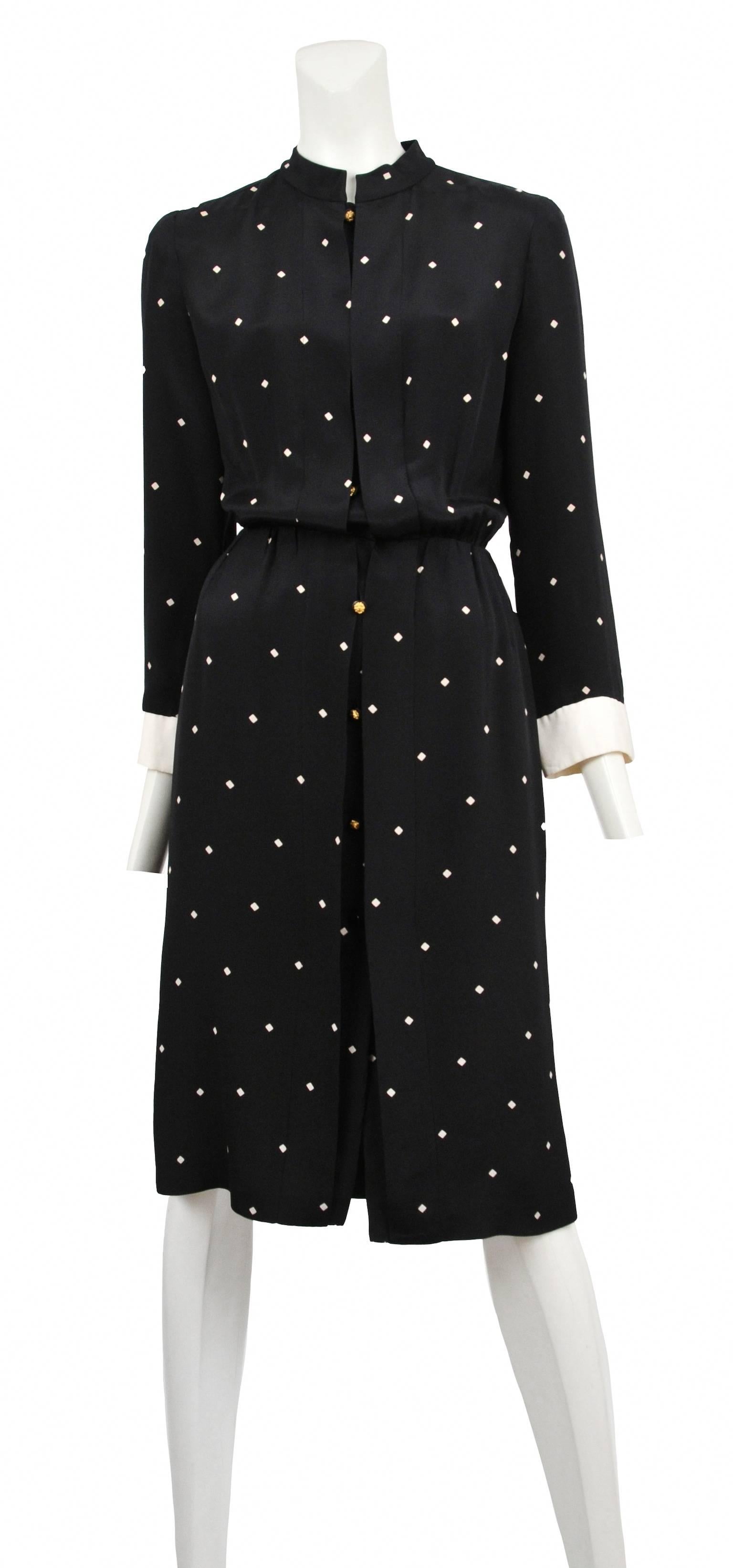Vintage Chanel black silk secretary dress with diamond dot print and white cream silk cuffs with gold lion buttons. Soft pleats on front and back panel.

Please contact us for additional photos.