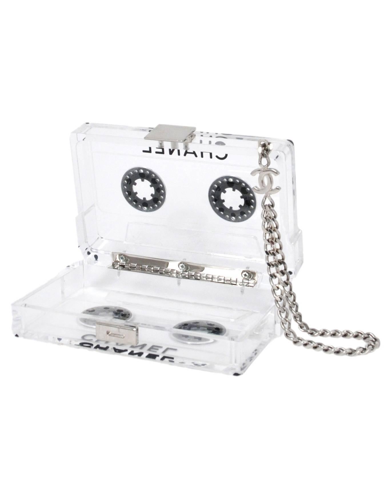 Vintage Chanel clear acrylic cassette clutch with silver wrist chain. Runway piece from the Spring / Summer 2004 Collection. All of our vintage designer luxury bags are guaranteed to be 100% authentic and original. Please contact us if you would