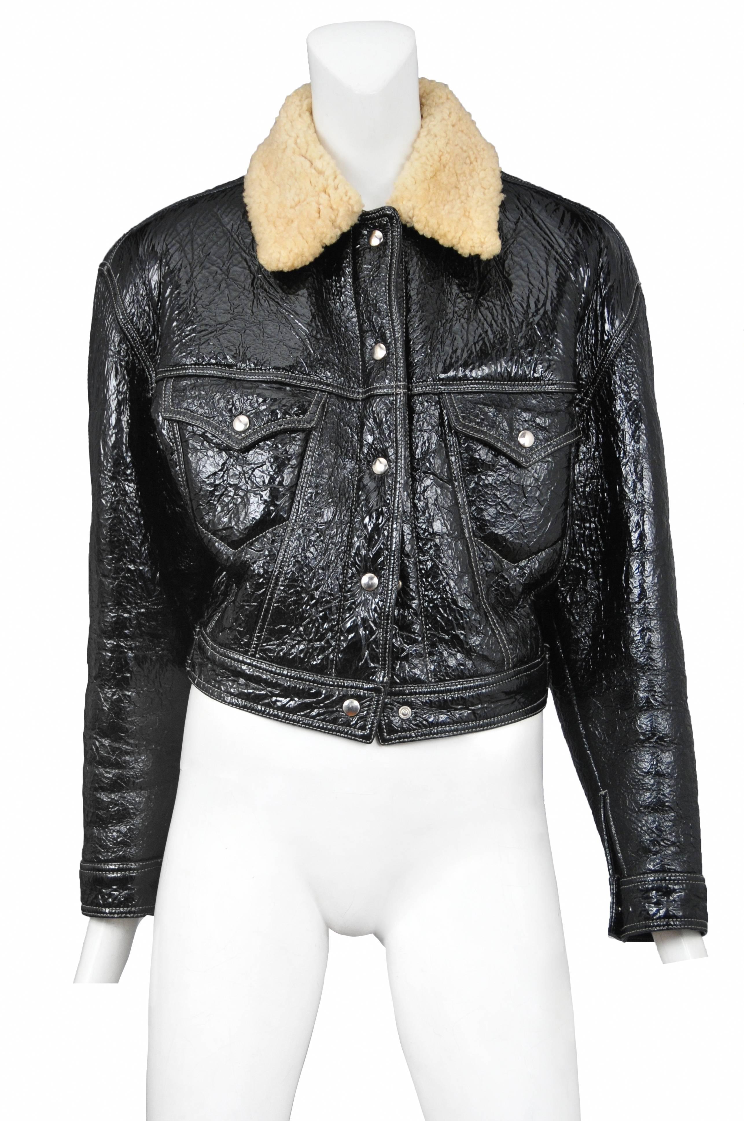Vintage Jean Paul Gaultier black patent leather snap front jacket featuring chest pockets and faux shearling at the collar.

Please inquire for additional images.