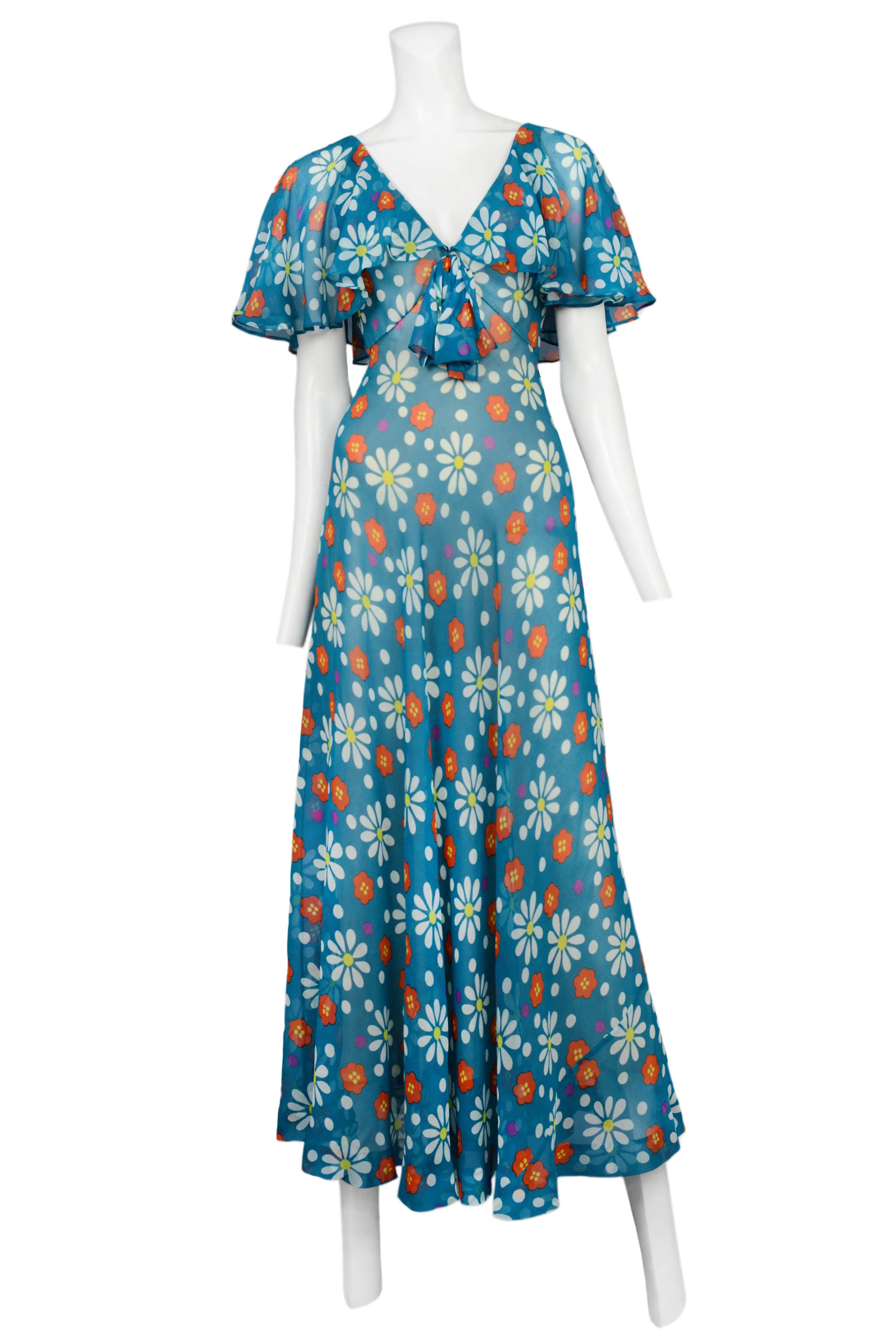 Vintage Yves Saint Laurent full length teal bohemian gown featuring an empire waist line, a tied bow under the bust, flutter sleeves and an allover daisy print.
Please inquire for additional images.
